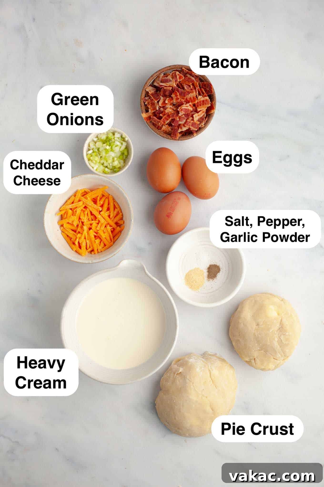 Bite-Sized Quiche Delights 3 An overhead view of the fresh ingredients needed to make delicious mini breakfast quiches, neatly arranged on a white surface.