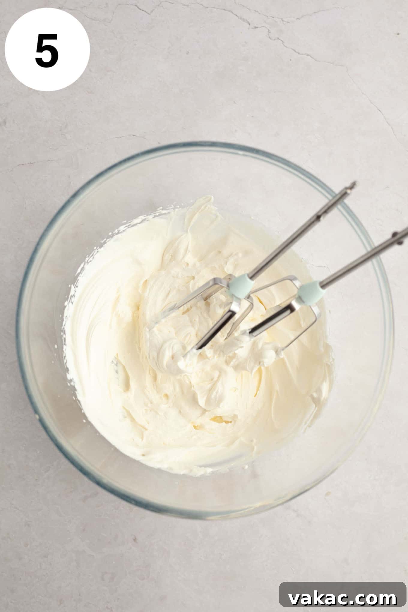 Cloud-Light Cupcakes 8 Whipped cream beat to stiff peaks in a glass mixing bowl.