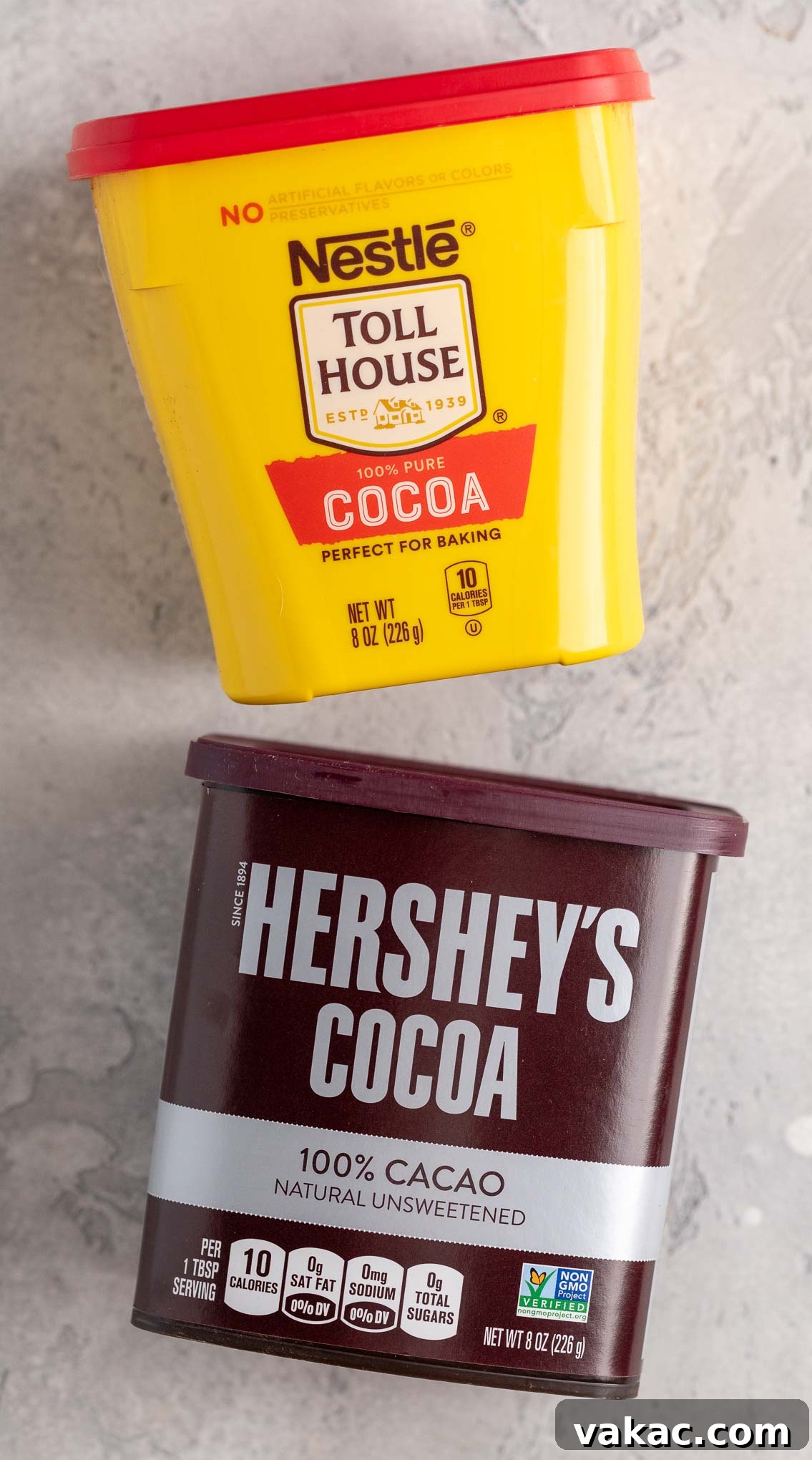 Natural vs. Dutch Process Cocoa: The Baker's Choice 3 An overhead view showing a package of Nestle cocoa powder alongside a package of Hershey's cocoa powder, illustrating common natural cocoa brands.