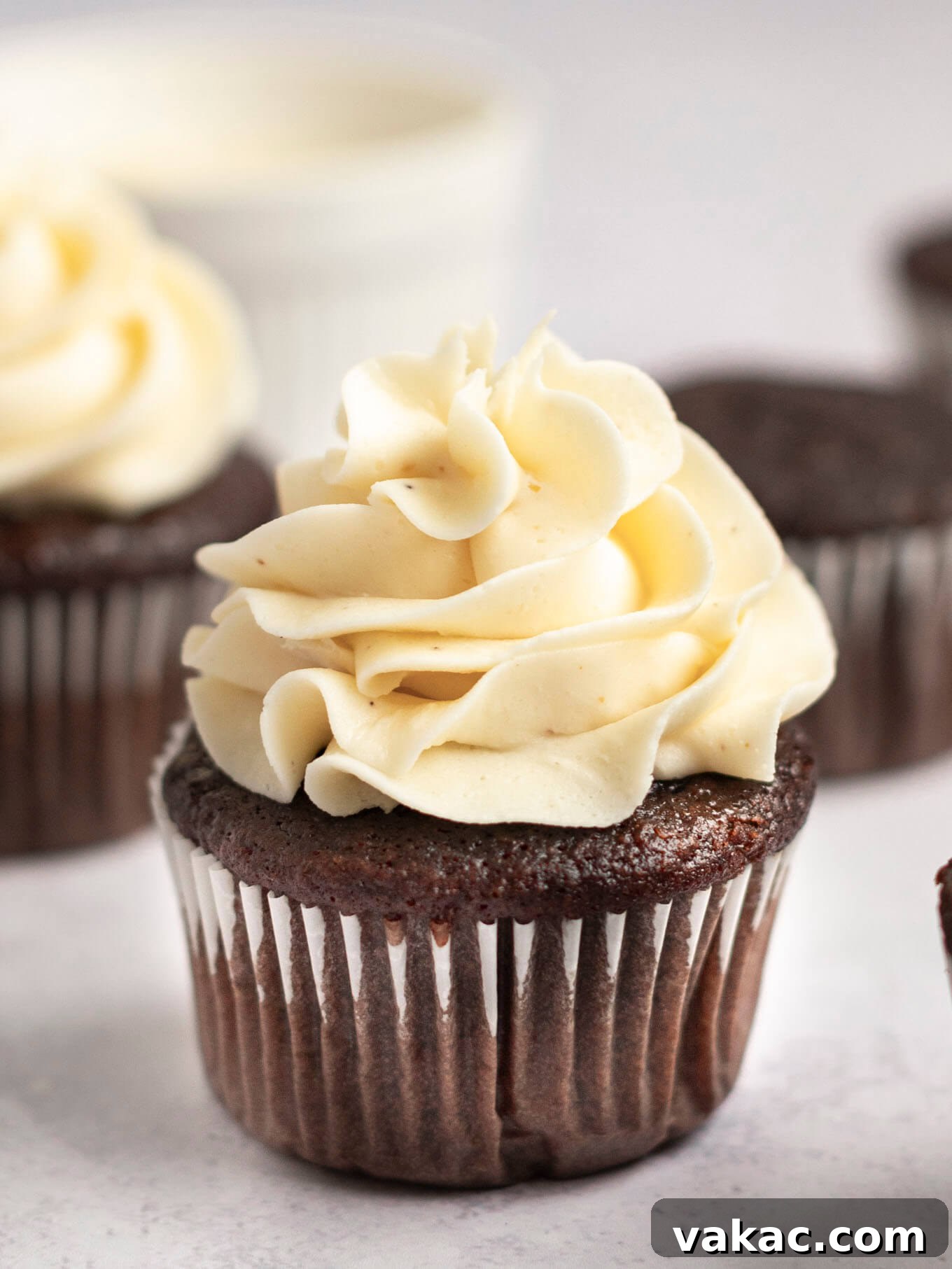 Caramelized Buttercream Dream 2 A chocolate cupcake topped with rich brown butter frosting, showcasing its smooth texture.