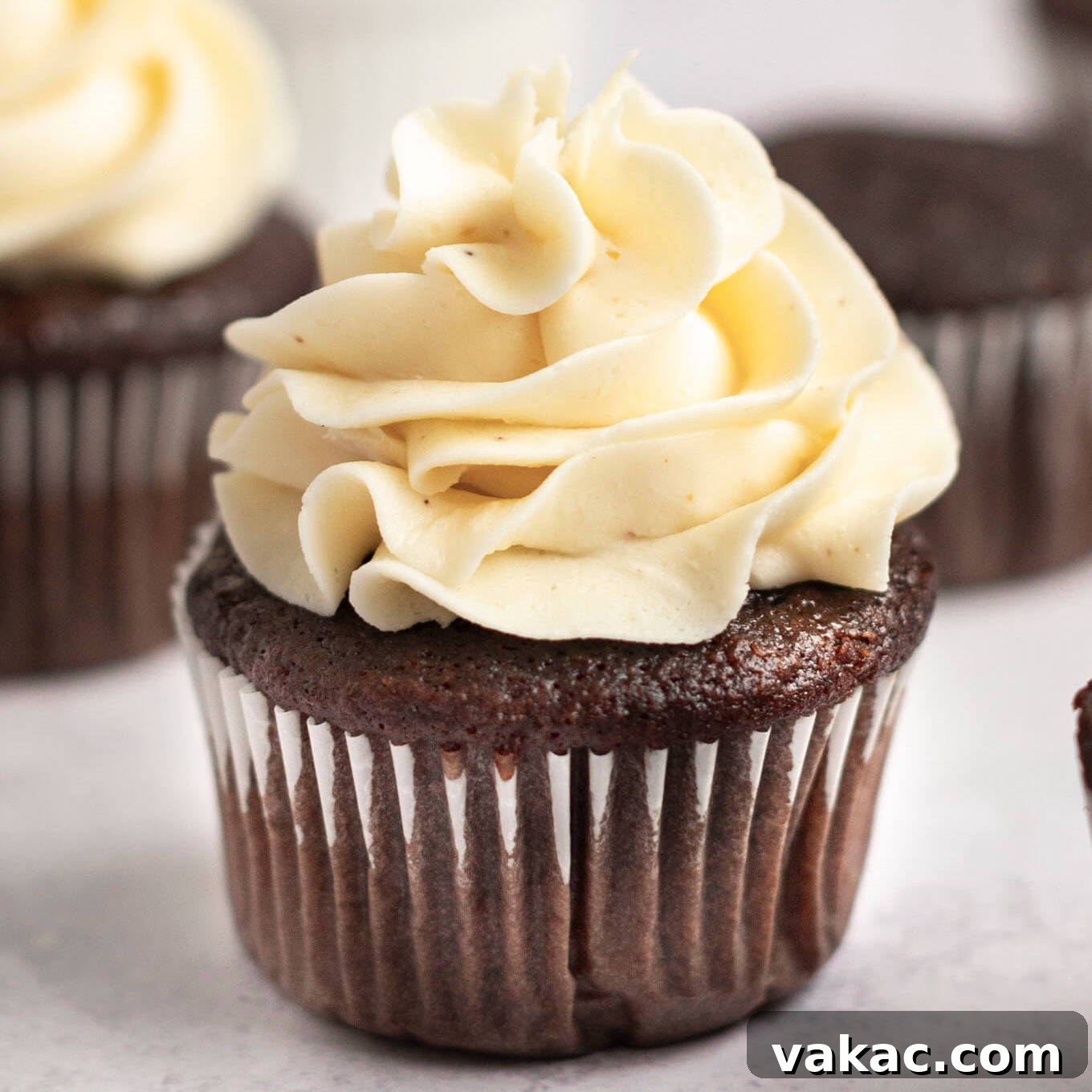 A chocolate cupcake topped with brown butter frosting.