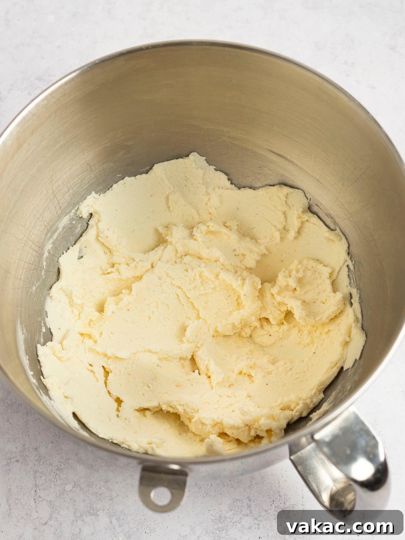 Caramelized Buttercream Dream 7 Creamed butter and powdered sugar being mixed together in a stand mixer.