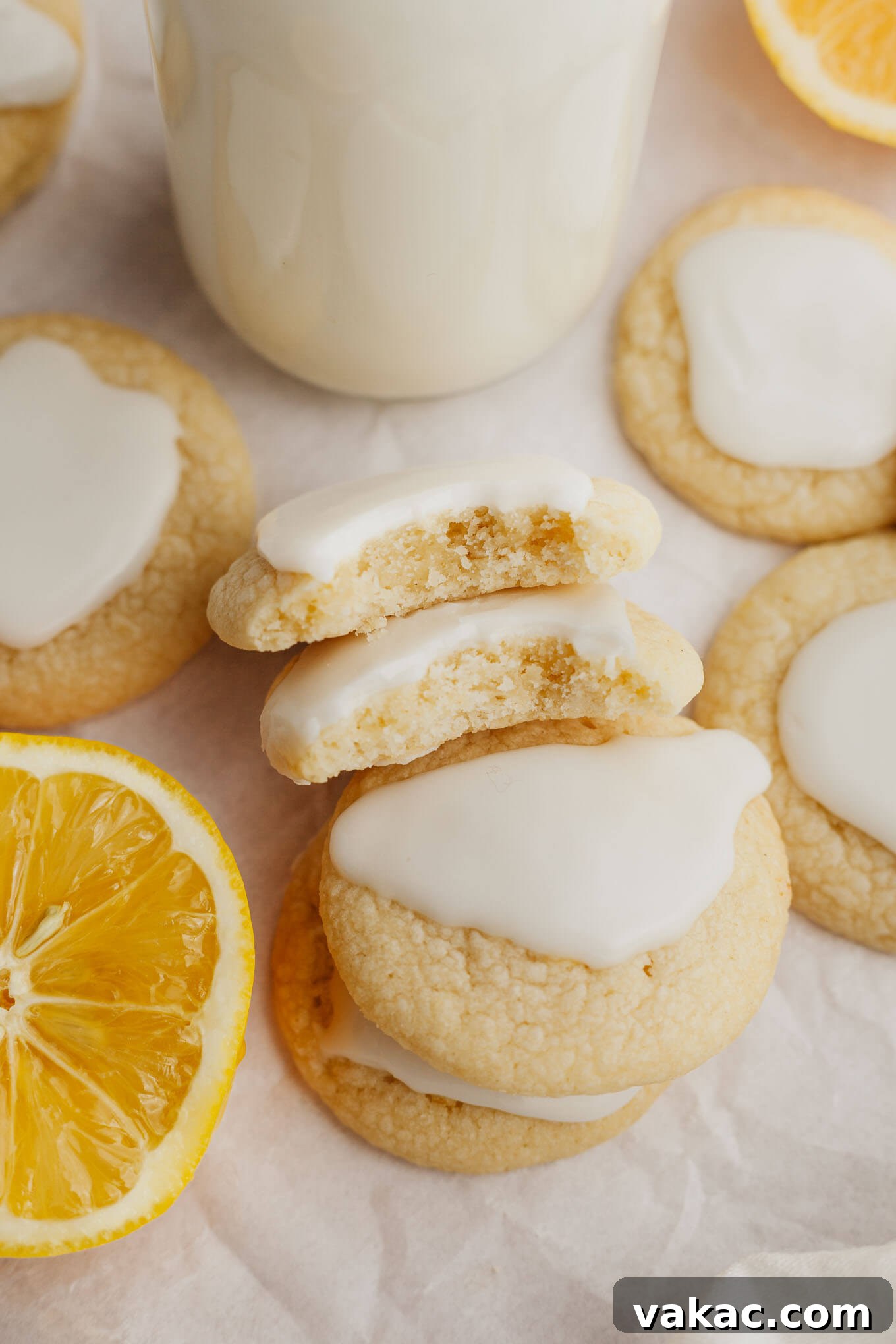 An overhead view of several lemon meltaway cookies stacked on their sides, revealing their perfectly baked, soft, and slightly crumbly interior texture.