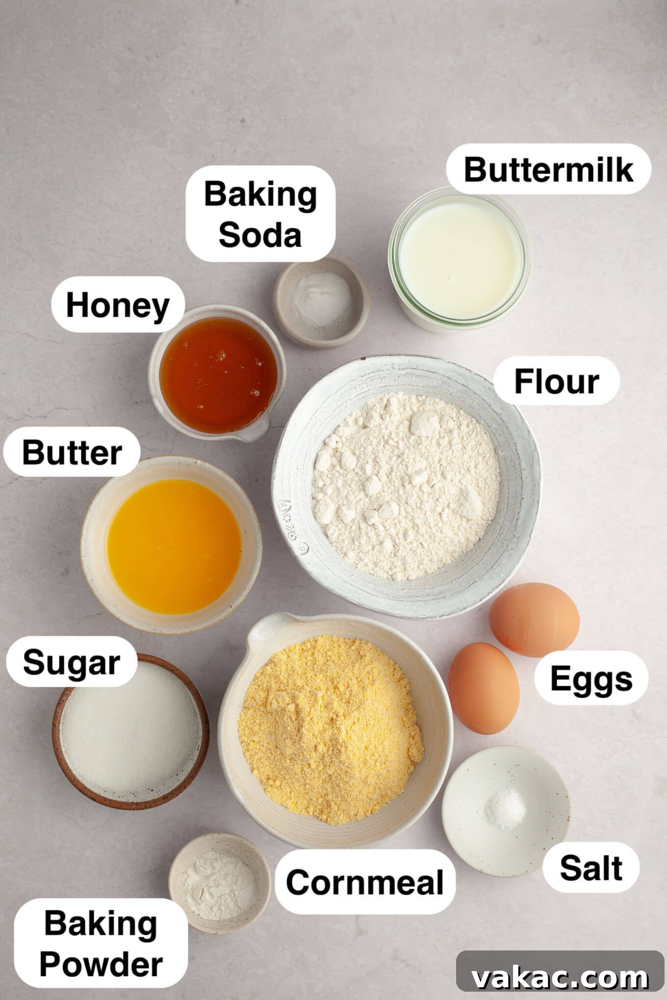 Golden Fluffy Cornbread Muffins 3 An overhead view of the carefully measured ingredients needed to make cornbread muffins, laid out on a clean surface.
