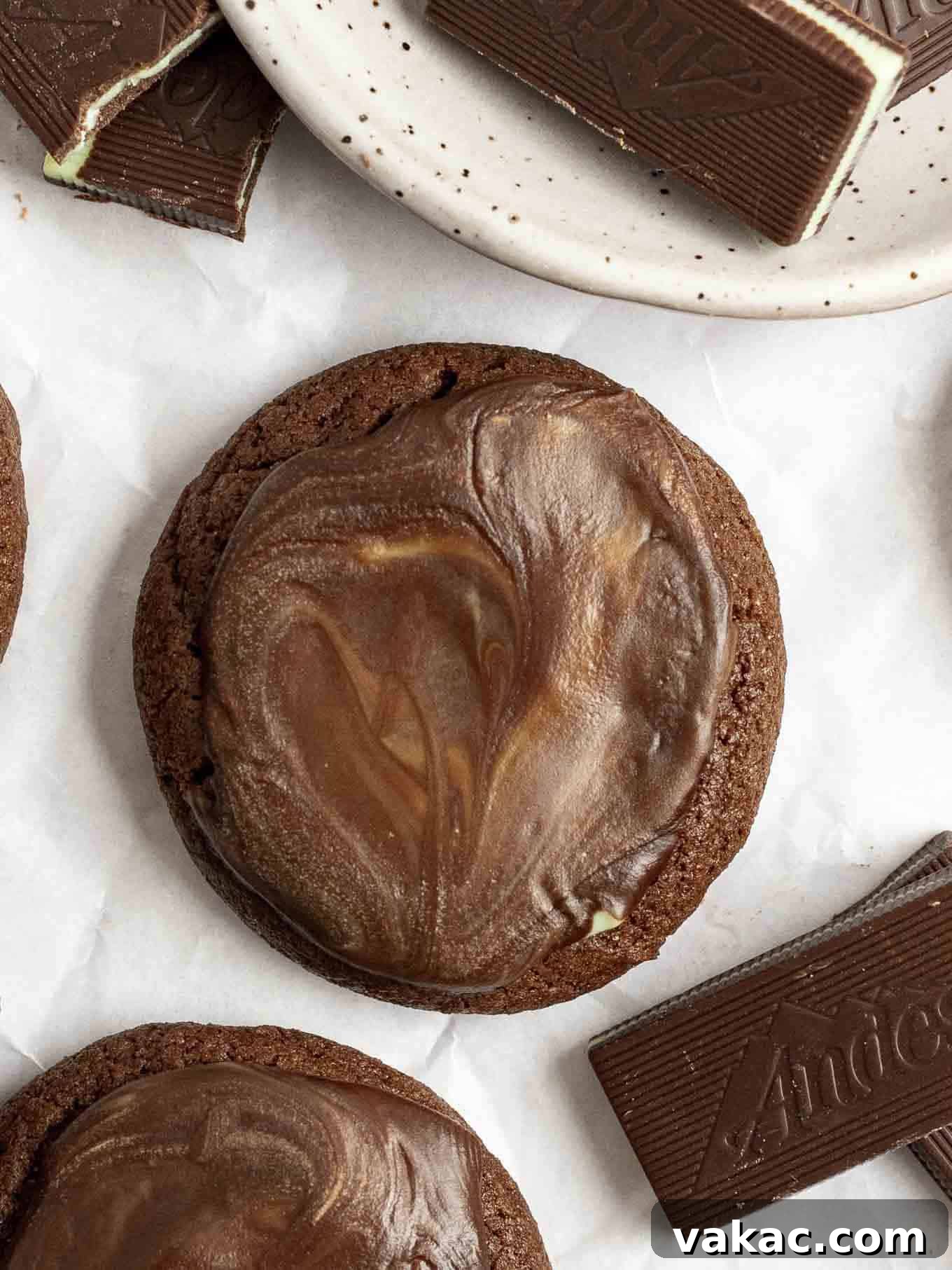 A close-up, overhead view of a single Andes Mint cookie, showcasing its perfect texture and mint topping.