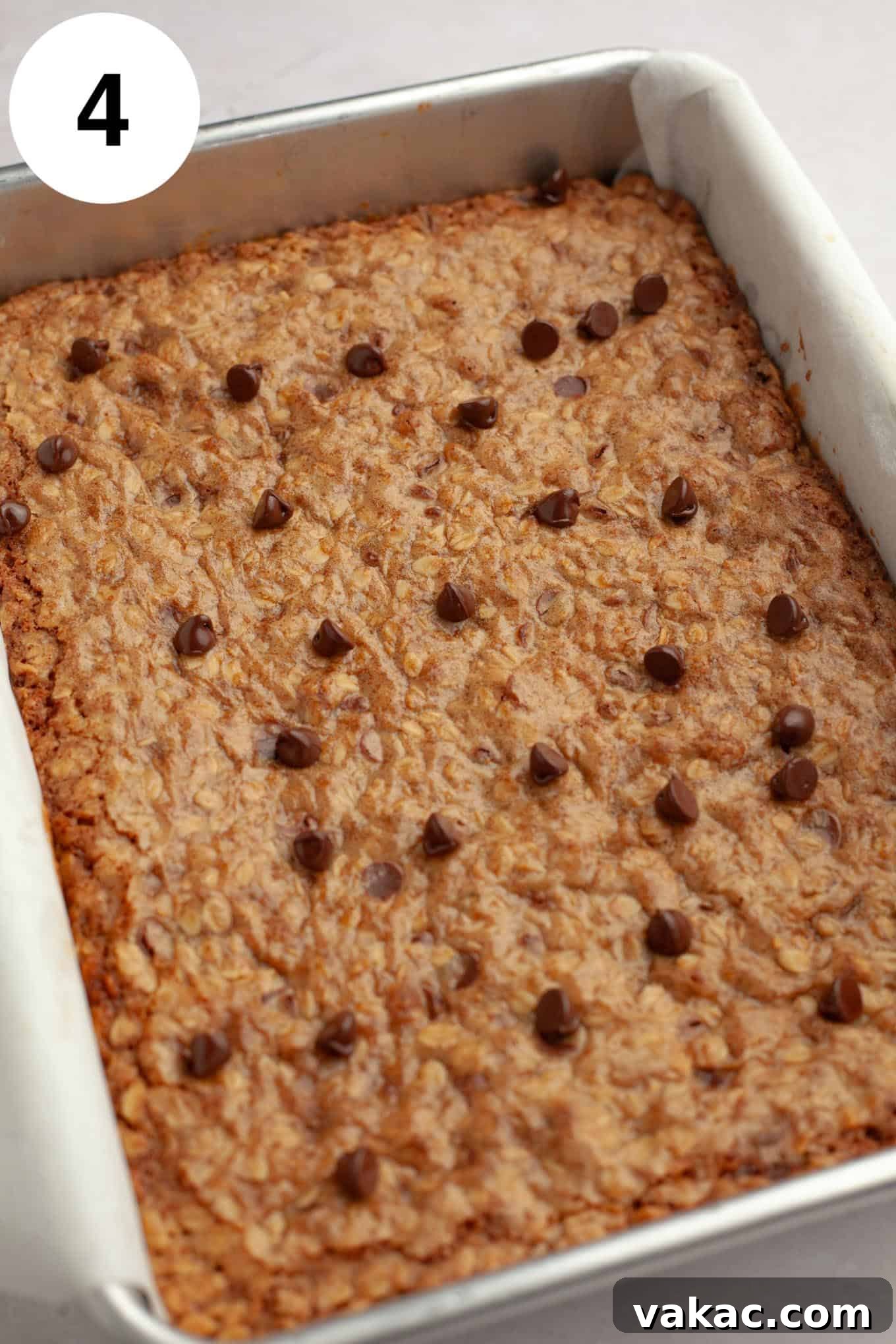 Golden Oatmeal Bars 7 A close-up of a pan filled with freshly baked, golden-brown oatmeal cookie bars, indicating a perfect bake.