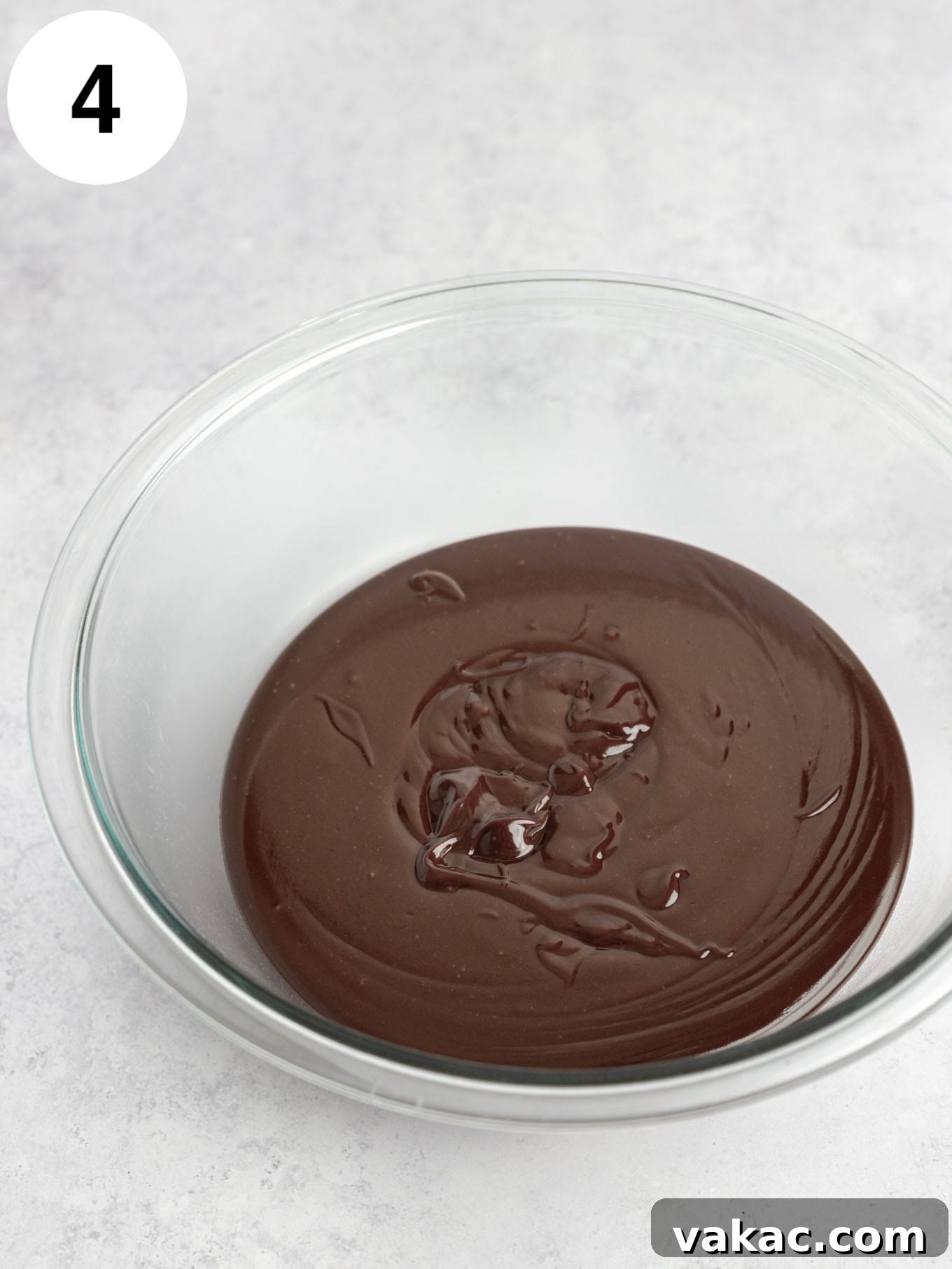 Decadent Homemade Hot Fudge Sauce 7 A glass bowl of hot fudge.