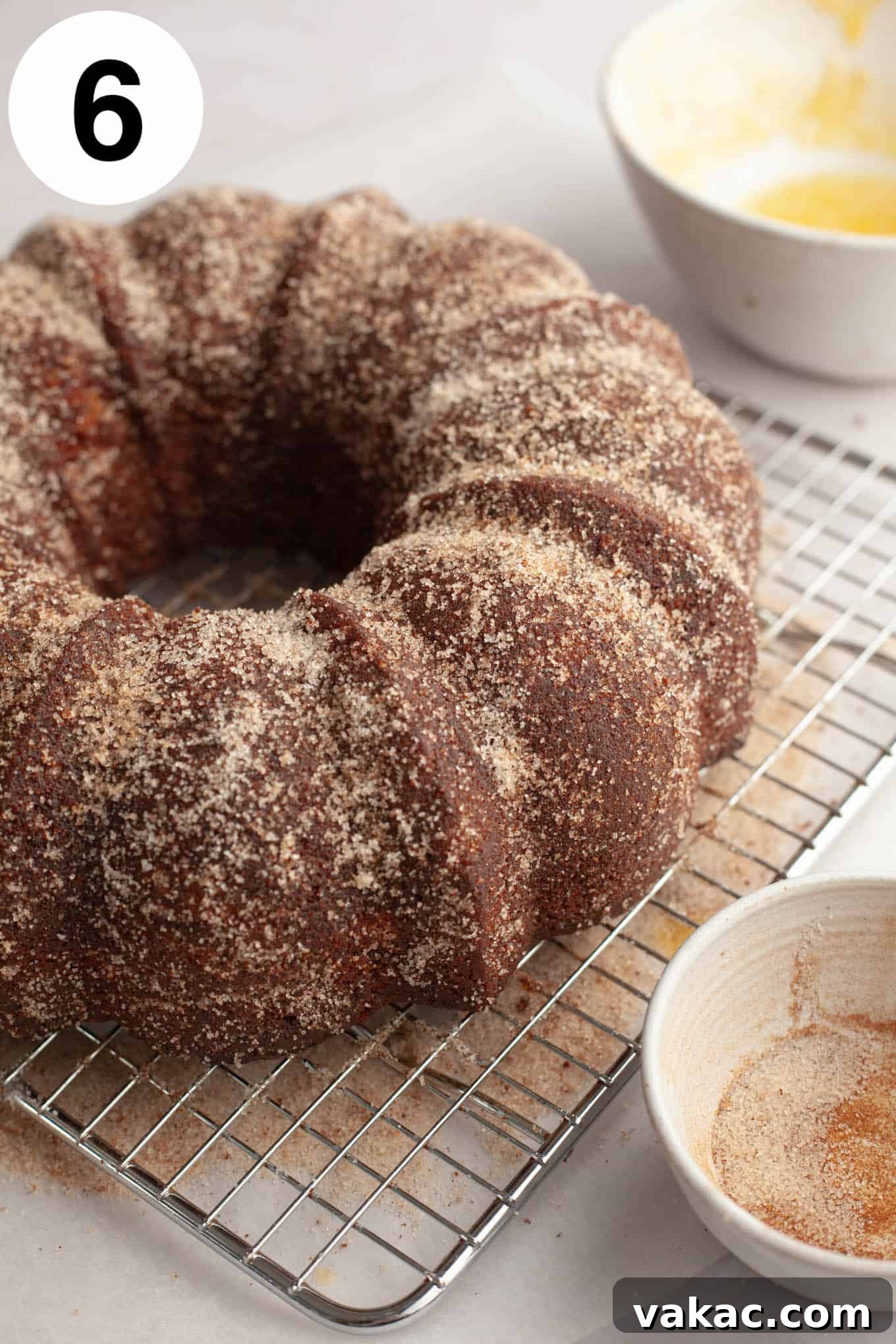 Cinnamon Sugar Cider Cake 9 A cinnamon sugar-coated apple donut cake on a wire rack.