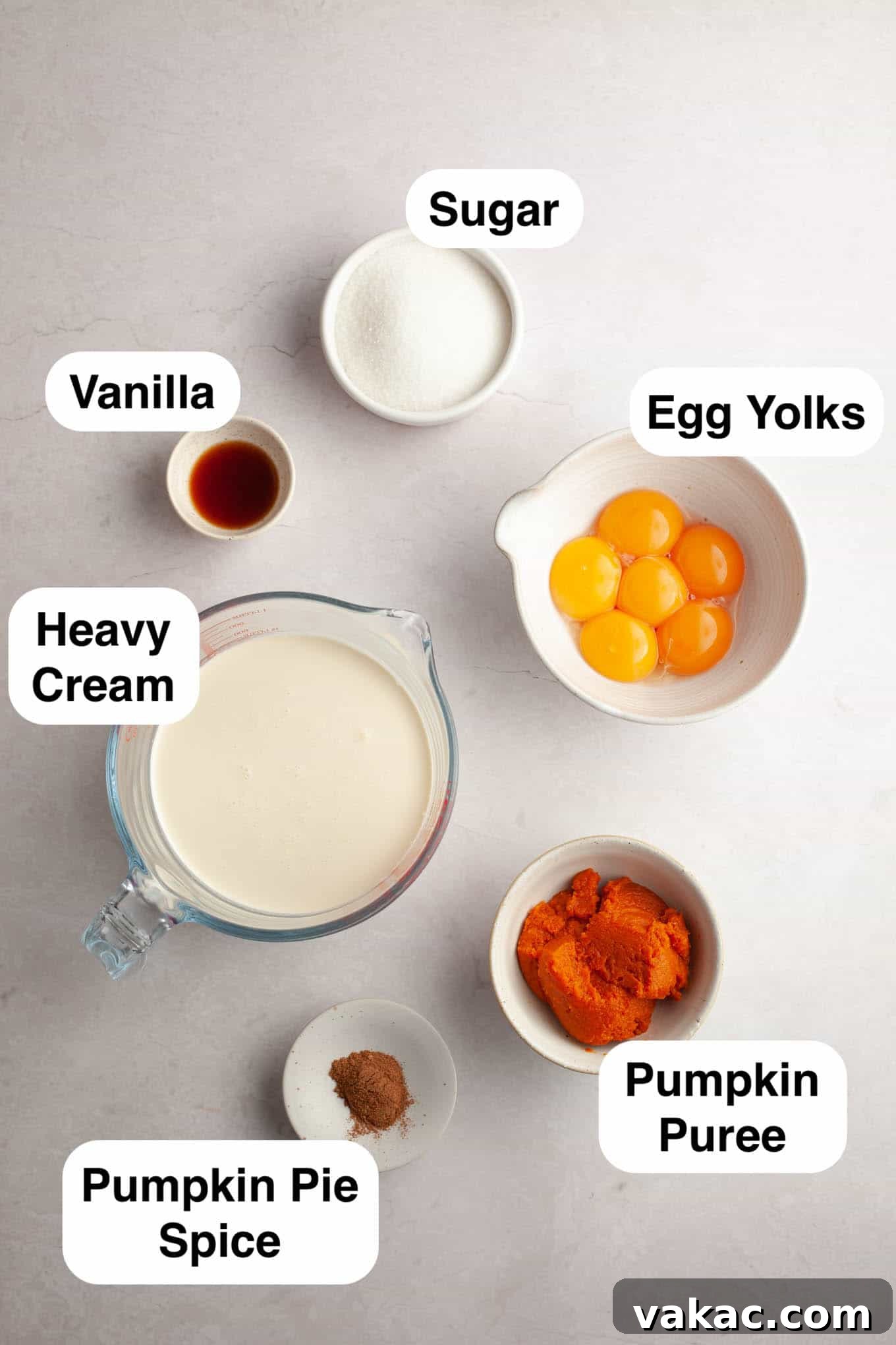 Spiced Pumpkin Creme Brulee 3 An overhead view of the six simple ingredients required to make delicious pumpkin spice crème brûlée, neatly arranged on a counter.