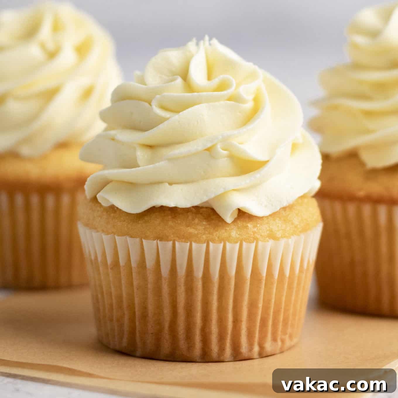 Velvet White Chocolate Frosting 7 A vanilla cupcake topped with white chocolate frosting.
