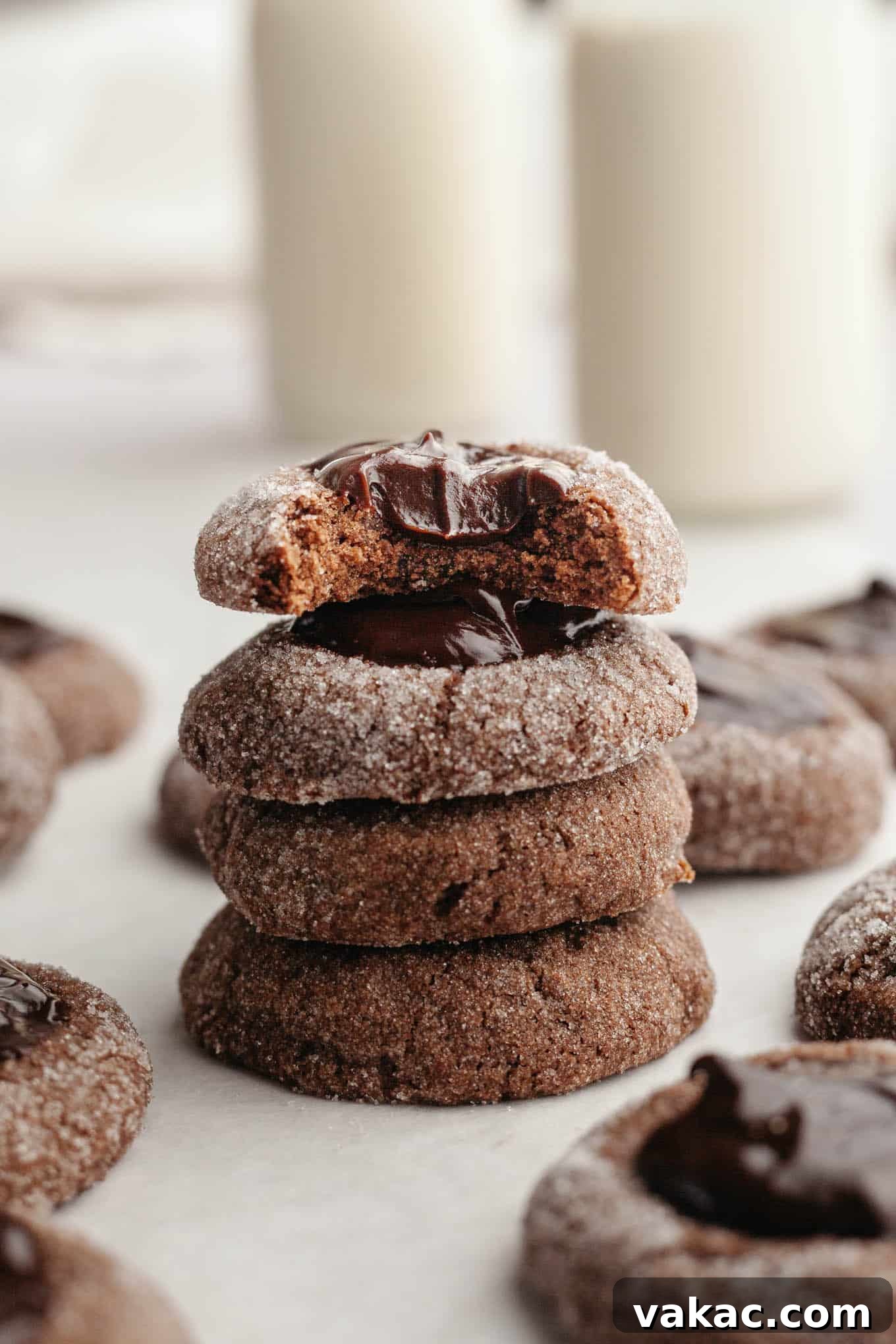 Decadent Chocolate Thumbprint Delights 2 Four chocolate thumbprints stacked on top of each other, showcasing their rich color and ganache filling.