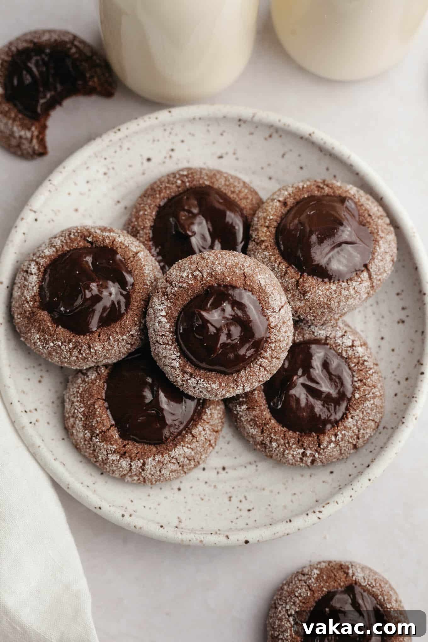 Decadent Chocolate Thumbprint Delights 10 An overhead view of a beautifully arranged plate of chocolate thumbprint cookies, ready to be enjoyed.