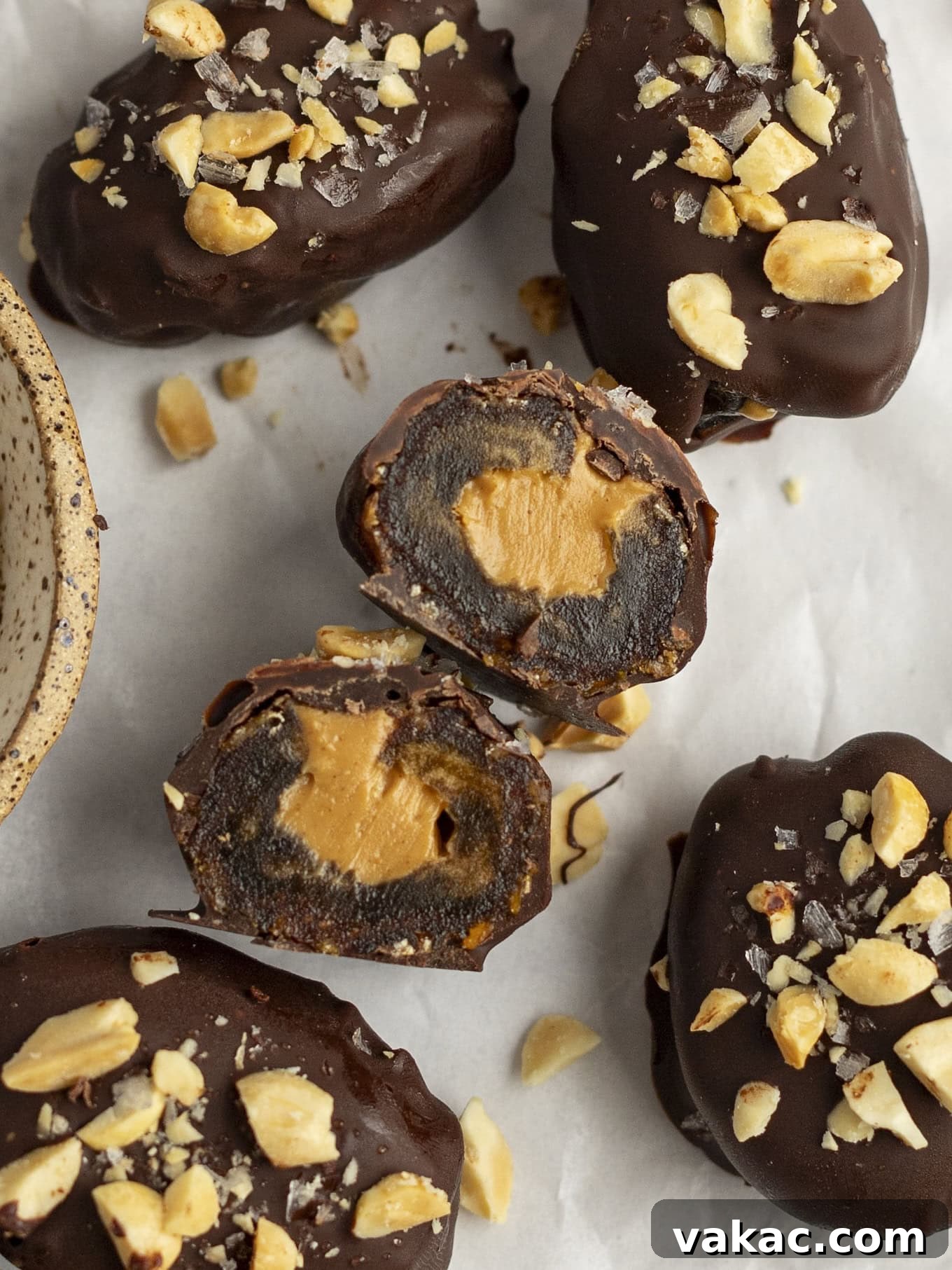 Date Peanut Chocolate Bites 2 An overhead view of a date Snickers cut in half to show the filling.
