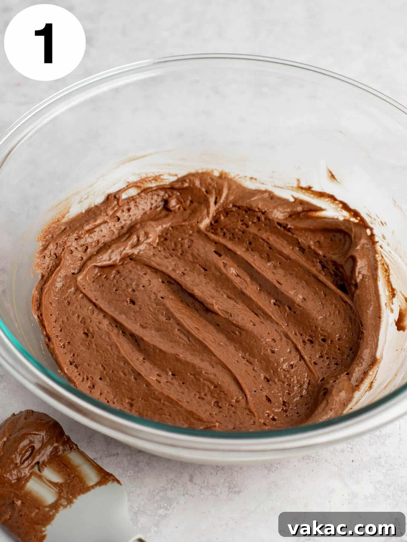 Velvet Chocolate Indulgence 4 Chocolate cake batter in a glass mixing bowl.