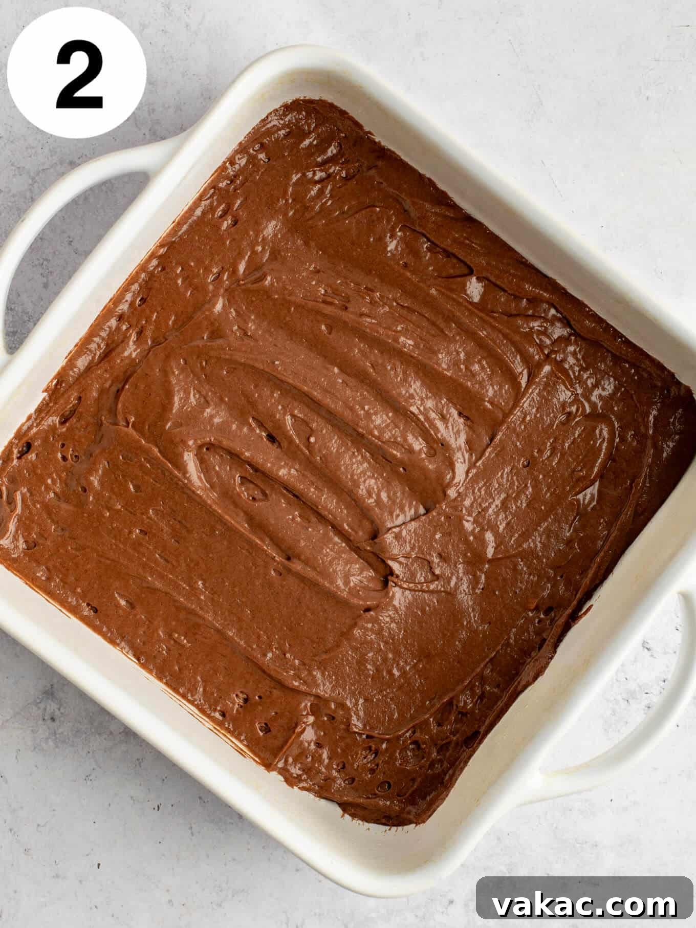 Velvet Chocolate Indulgence 5 An overhead view of chocolate cake batter in a baking dish.
