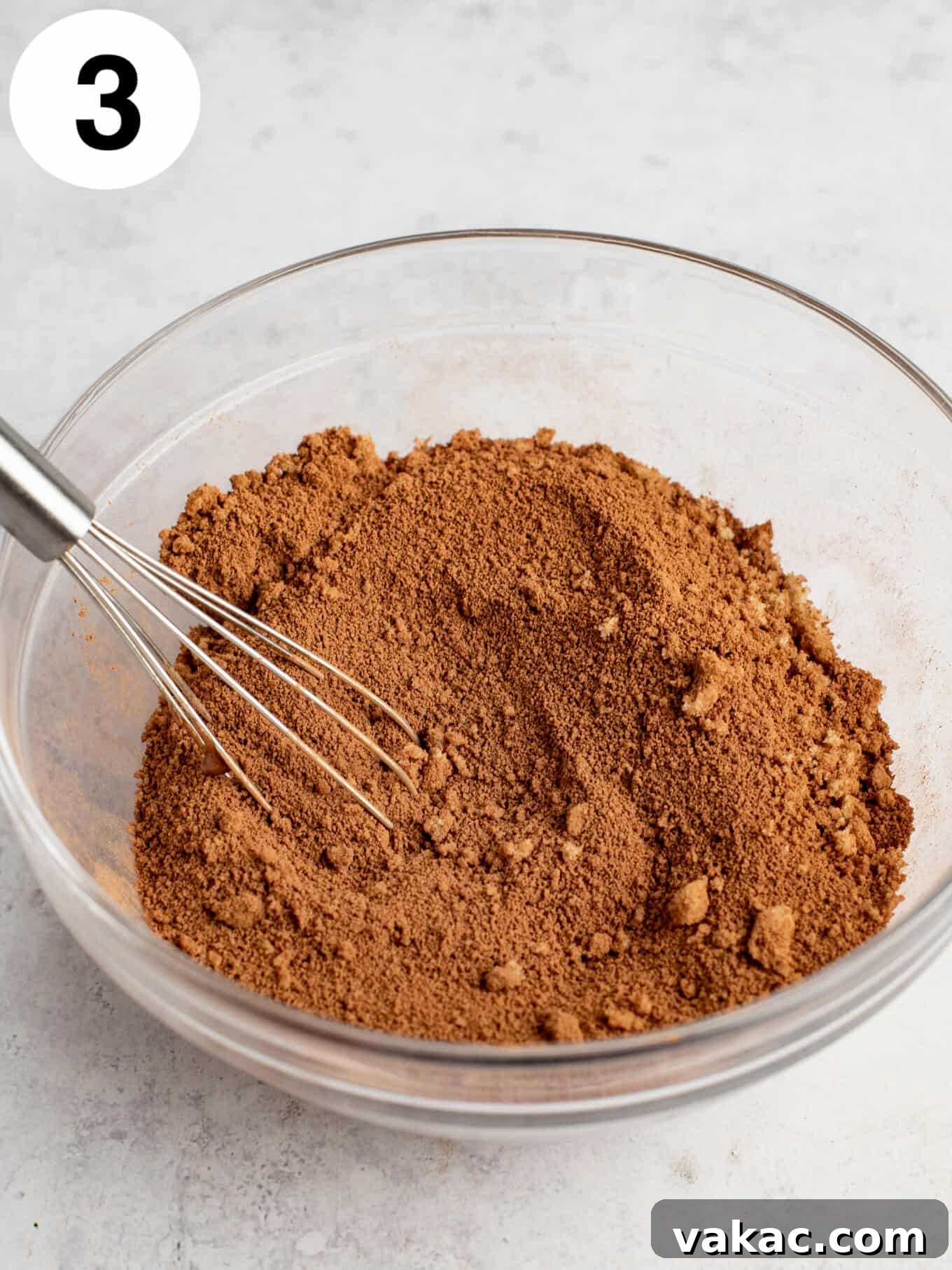 Velvet Chocolate Indulgence 6 A mixture of cocoa powder and brown sugar in a mixing bowl, with a whisk.