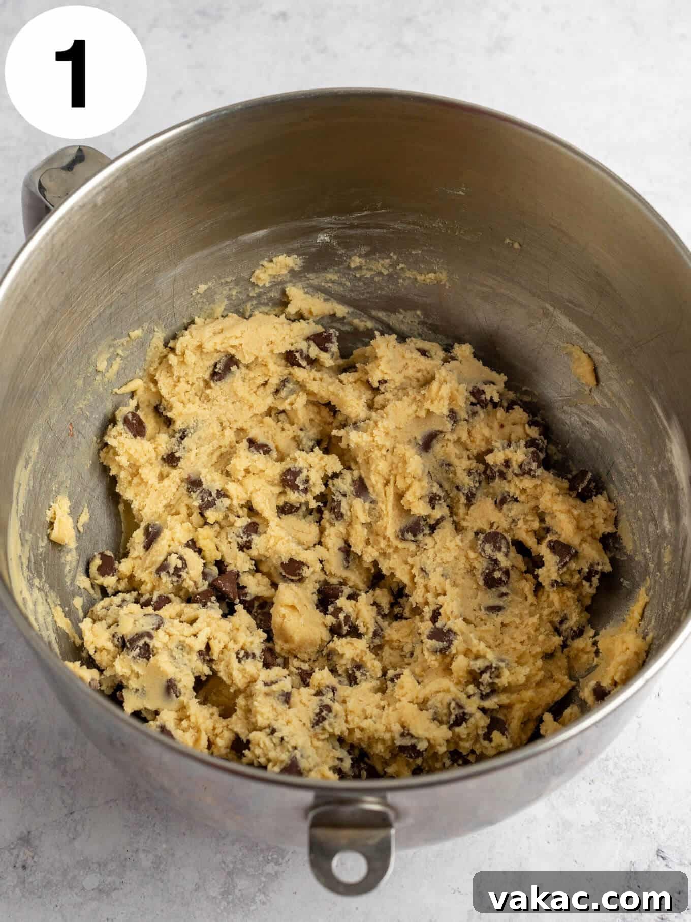 Reese's Peanut Butter Cup Overload Cookies 4 Raw chocolate chip cookie dough in the bowl of a stand mixer, ready for freezing.