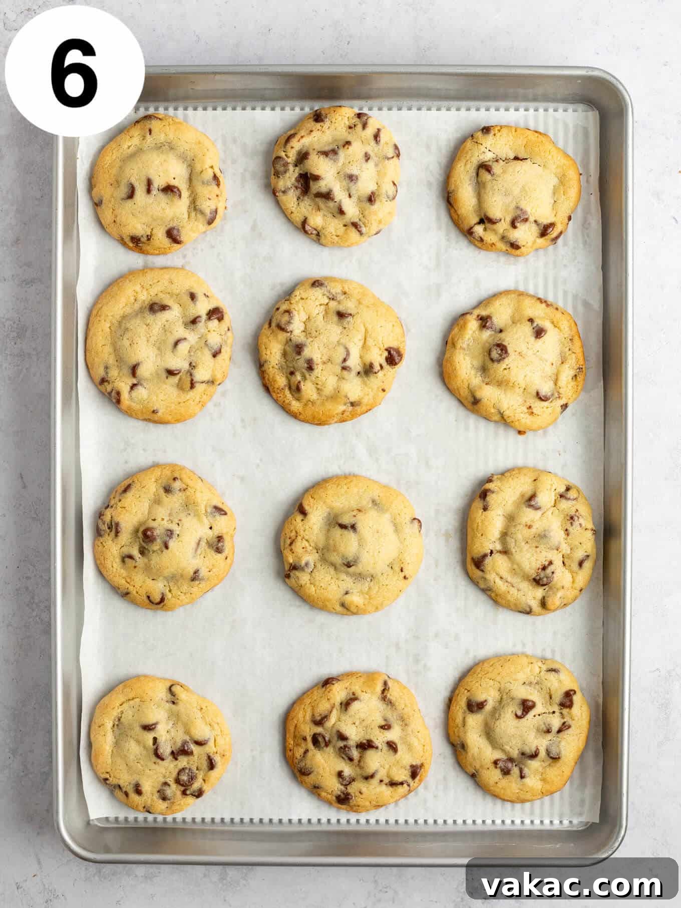 Reese's Peanut Butter Cup Overload Cookies 9 An overhead view of freshly baked Reese's stuffed cookies on a baking sheet, golden brown and tempting.