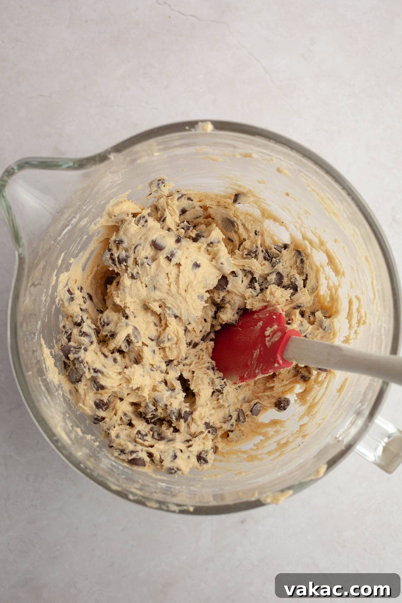 Banana Bliss Chocolate Chip Cookies 6 Cookie dough in a glass mixing bowl, perfectly mixed and ready for chilling.