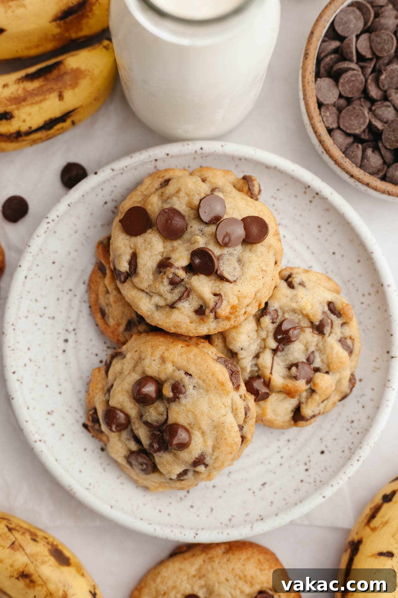 Banana Bliss Chocolate Chip Cookies 8 An overhead view of banana and chocolate chip cookies piled on a plate, ready to be enjoyed.