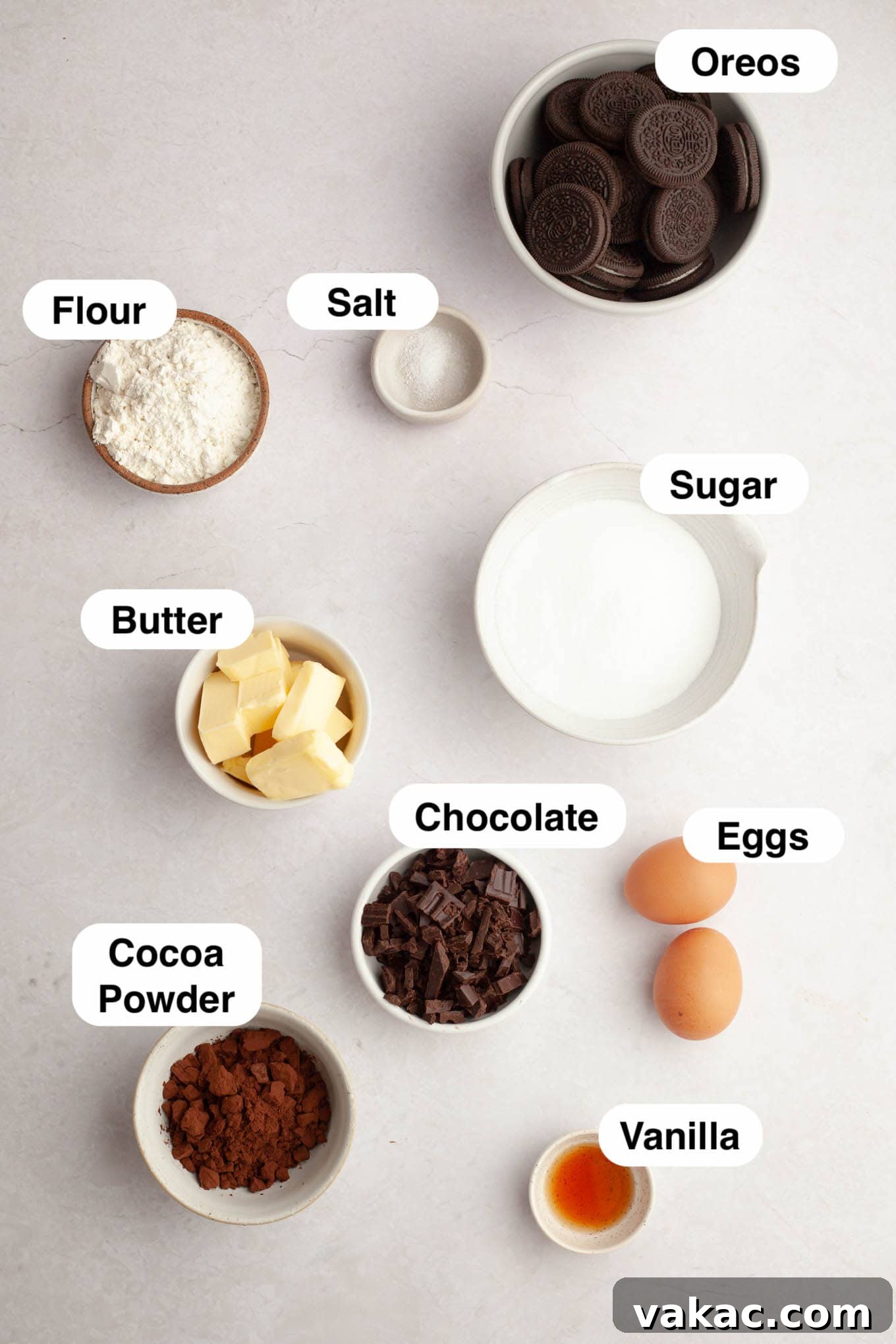 An overhead shot displaying all the fresh, high-quality ingredients laid out on a clean surface, meticulously measured and ready for baking delicious brownies with Oreos.