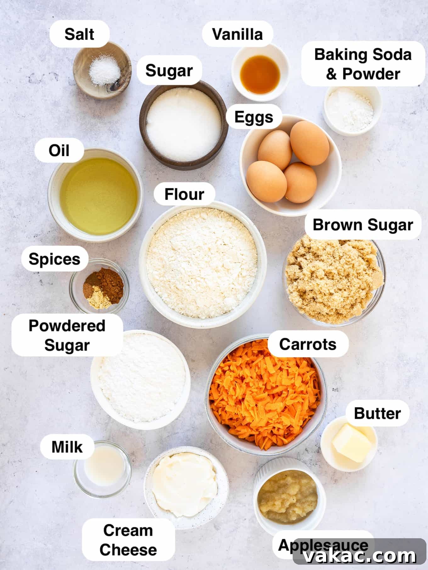 An overhead view of all the essential ingredients laid out neatly for making a carrot bundt cake.