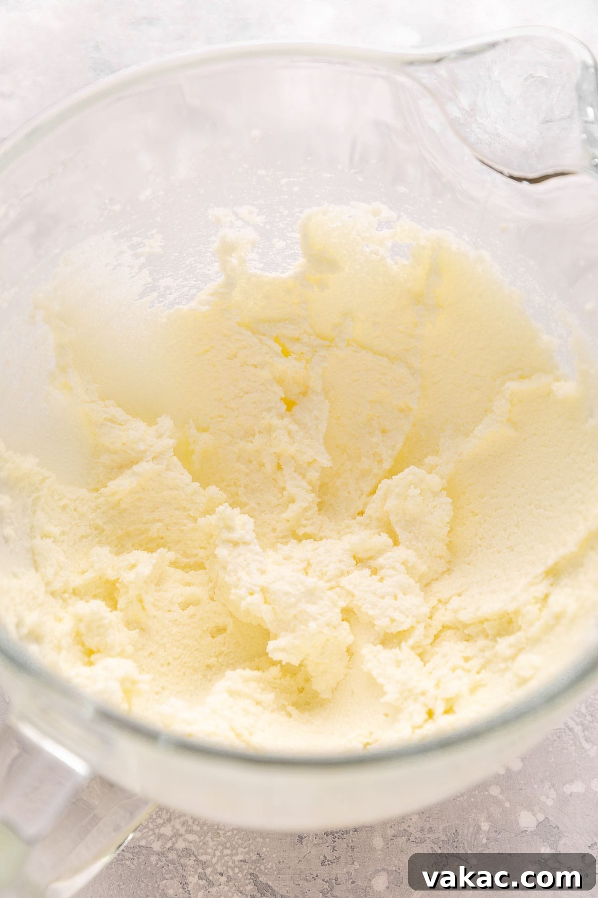 Fluffy White Cupcakes 5 Overhead view of perfectly creamed butter and granulated sugar, light and fluffy, in the bowl of a stand mixer.