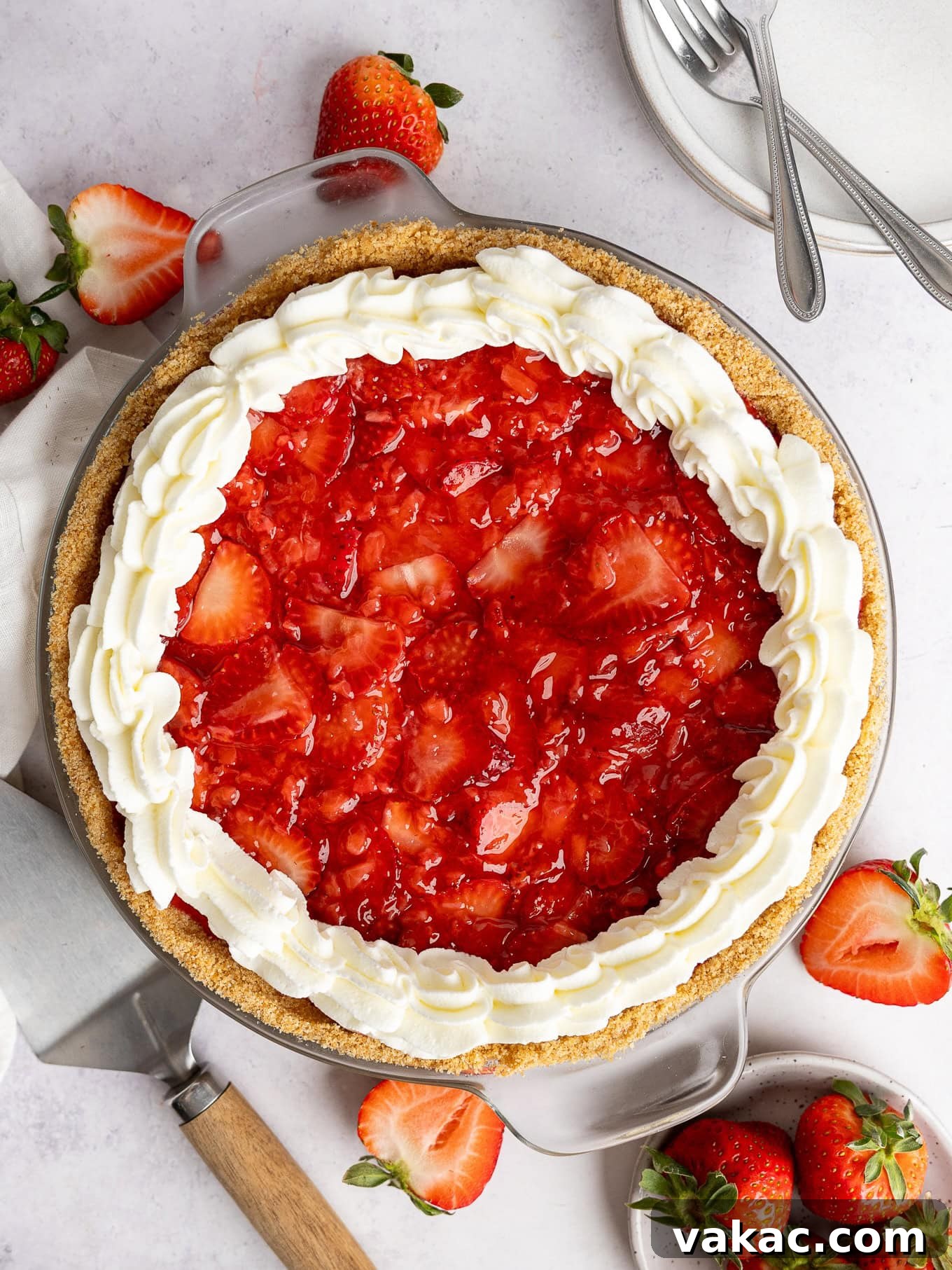 Strawberry Dream Cheesecake 2 An overhead view of a strawberry cream cheese pie, glistening with fresh strawberry topping.