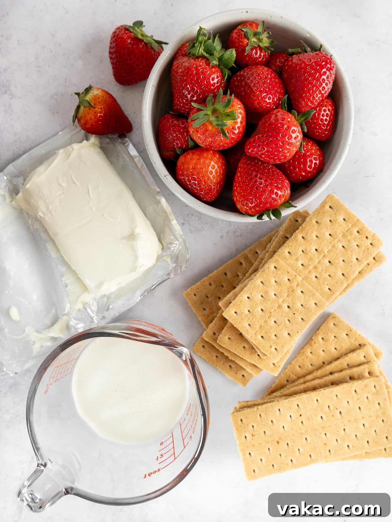Strawberry Dream Cheesecake 3 Ingredients needed to make a strawberry cream cheese pie laid out on a clean surface.