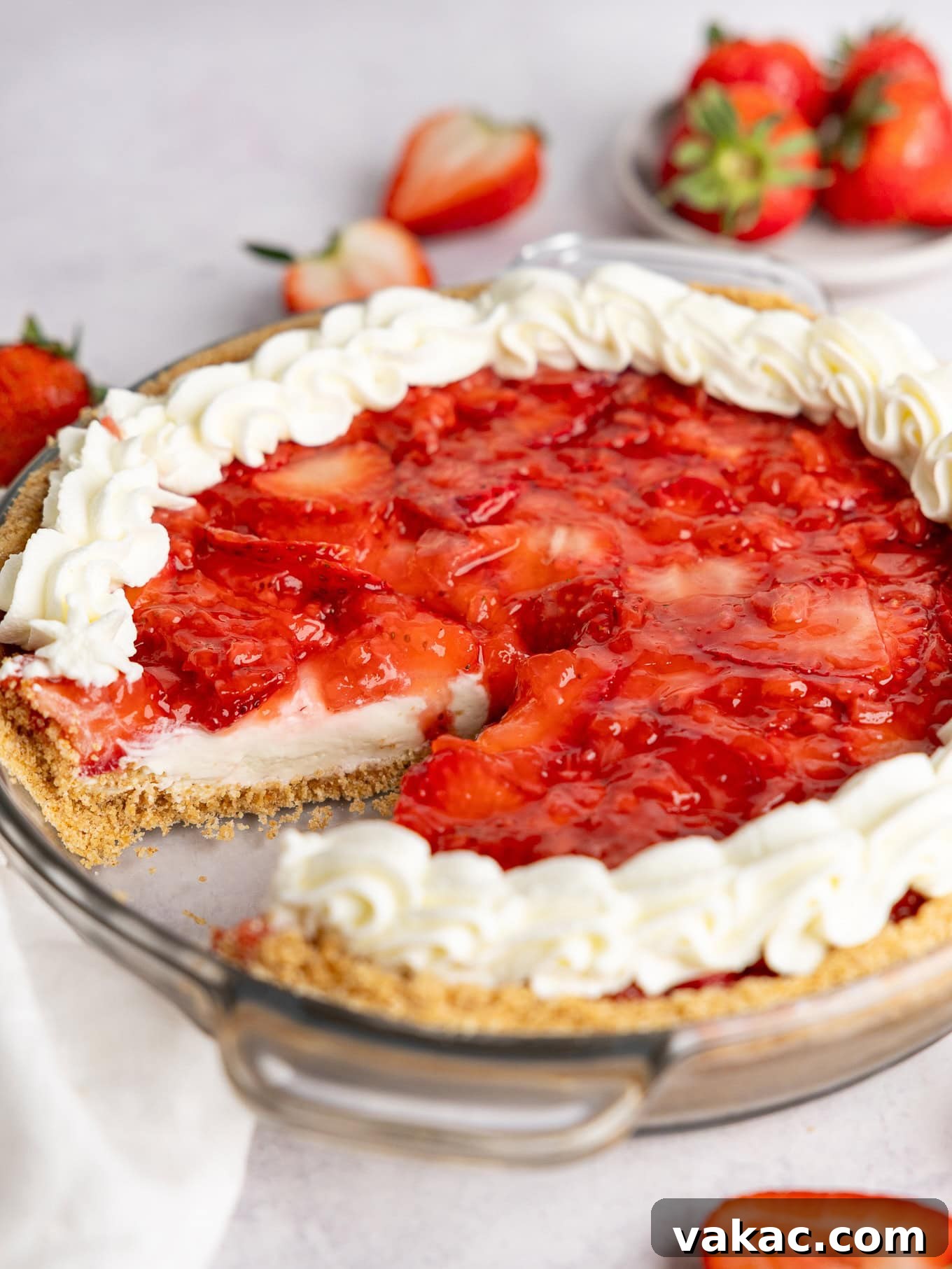 Strawberry Dream Cheesecake 10 A no bake strawberry cream cheese pie with a slice missing, showing the layers.