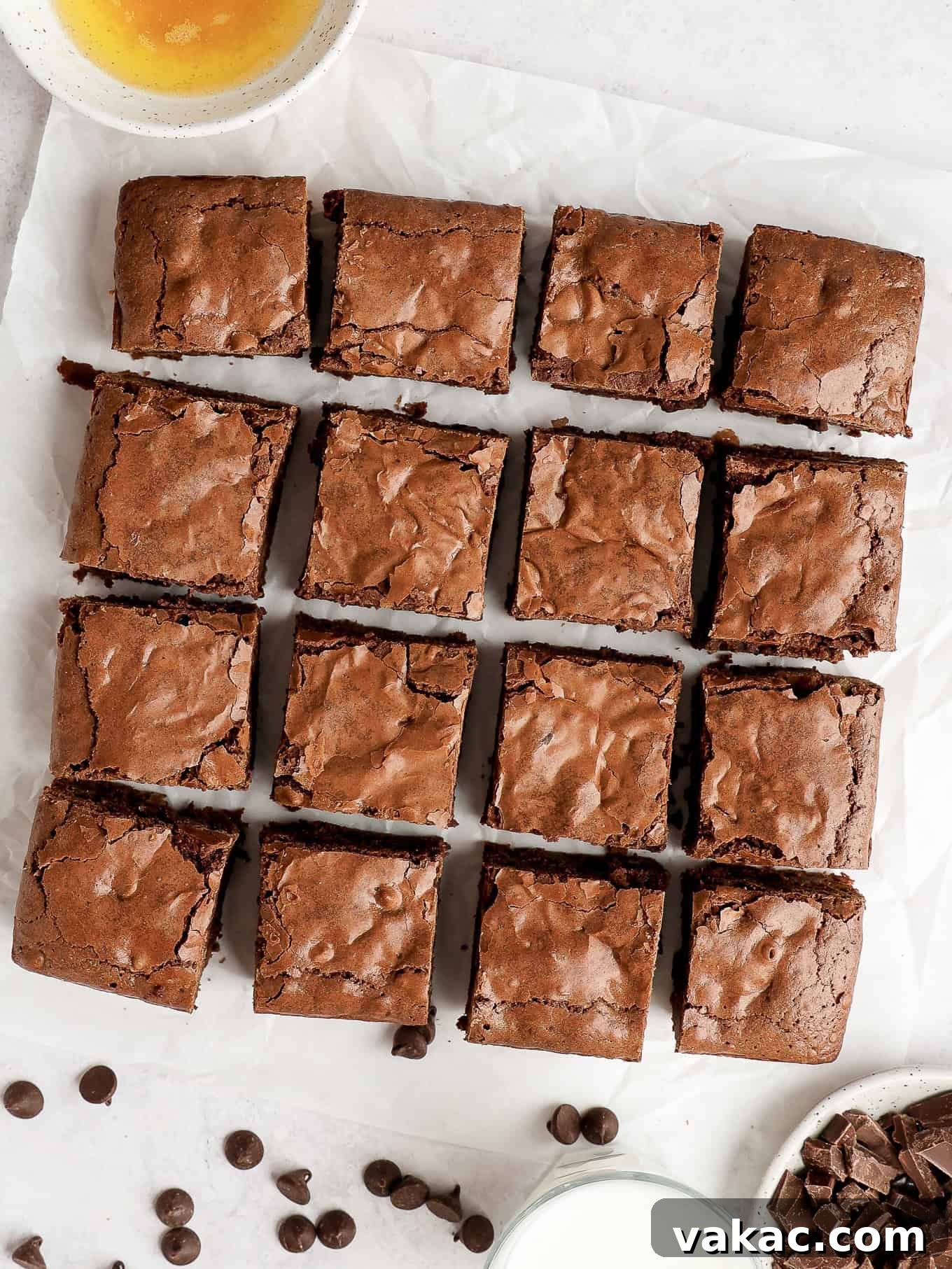 Caramelized Butter Brownie Bliss 2 An overhead view of perfectly sliced brown butter brownies on parchment paper, showcasing their fudgy texture.