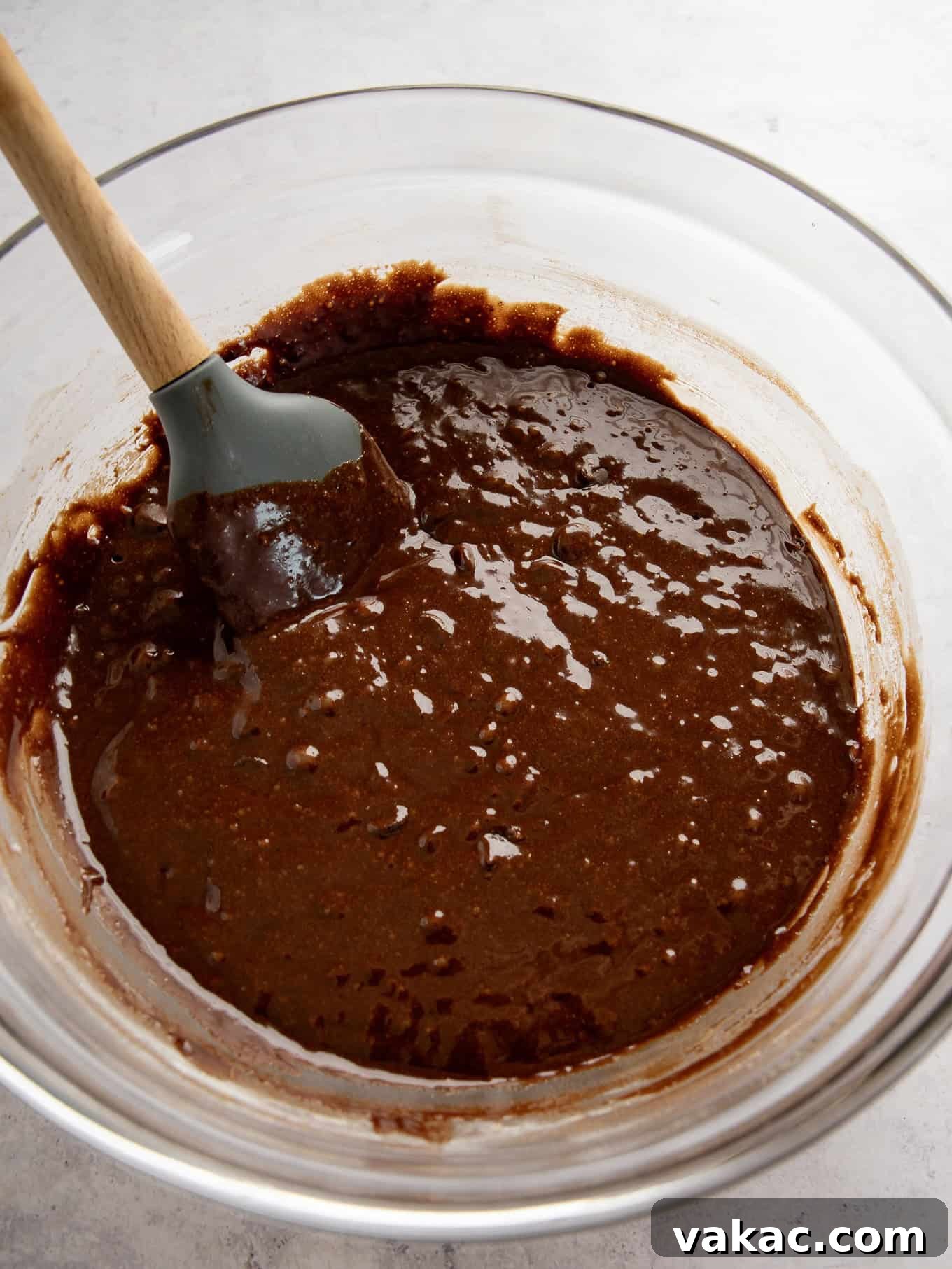 Caramelized Butter Brownie Bliss 5 An overhead view of rich, thick brown butter brownie batter in a mixing bowl with a spatula.