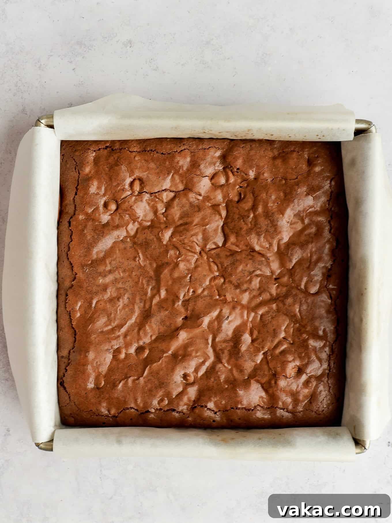 Caramelized Butter Brownie Bliss 6 An overhead view of a freshly baked pan of brown butter brownies, ready for cooling and slicing.