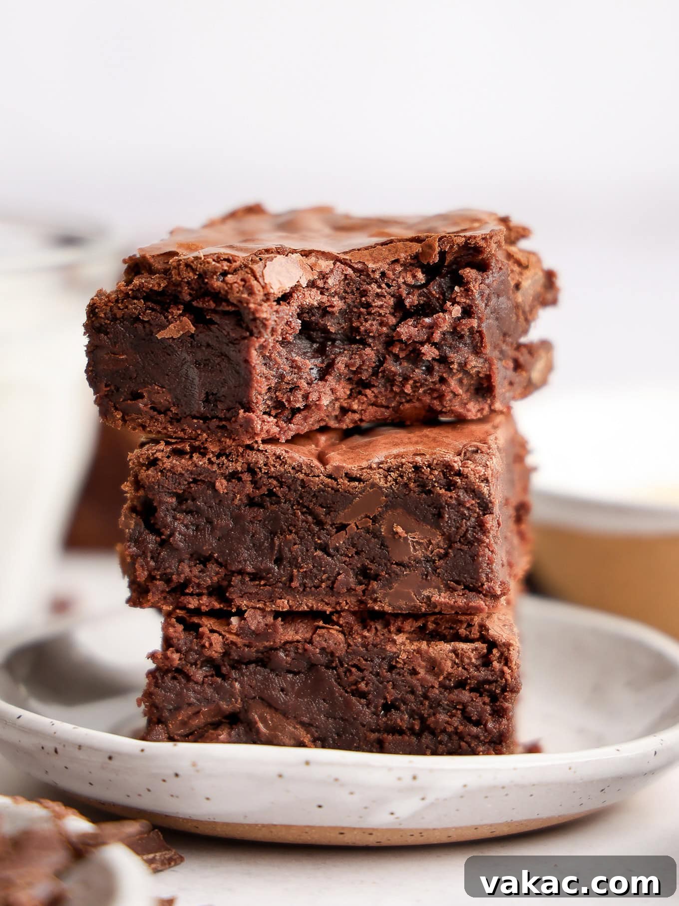 Caramelized Butter Brownie Bliss 7 A delectable stack of three thick, fudgy brown butter brownies, showcasing their rich interior.