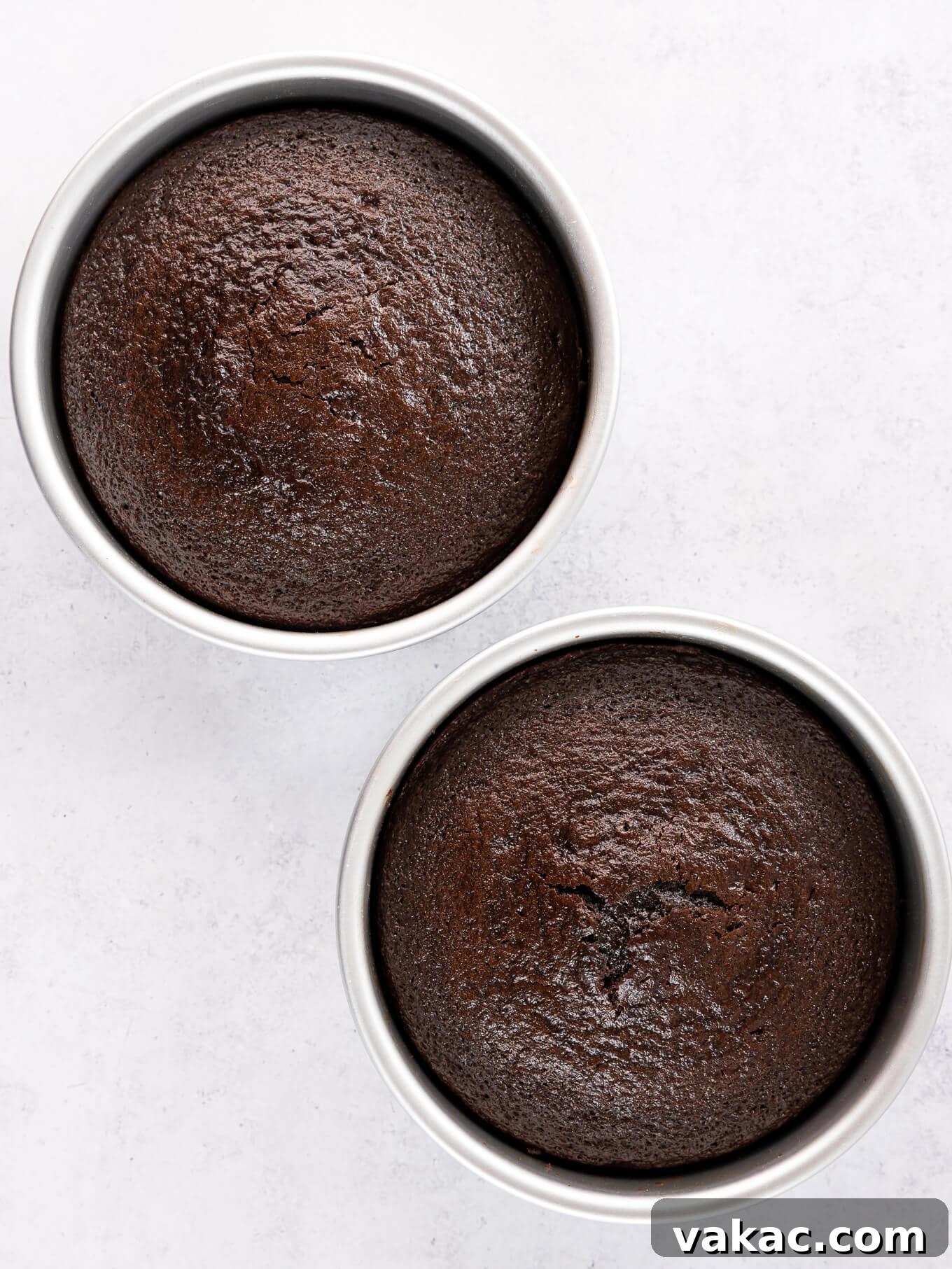 Mini Indulgence 6 Two perfectly baked and cooled 6-inch chocolate cake layers, stacked and ready for frosting.