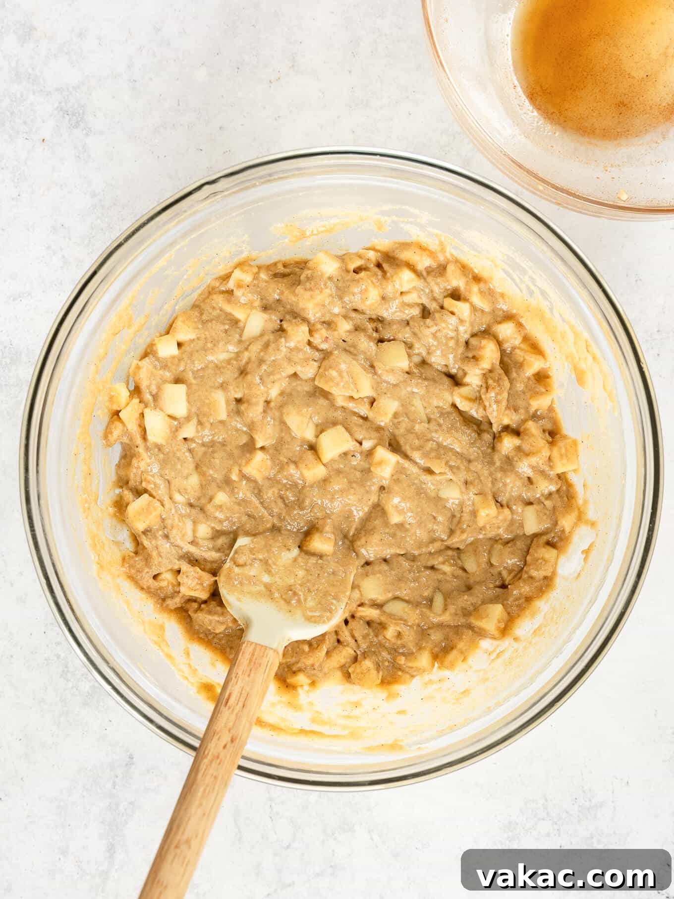 Spiced Apple Fritter Bake 5 Apple fritter cake batter in a mixing bowl, showing its thick, rich consistency.