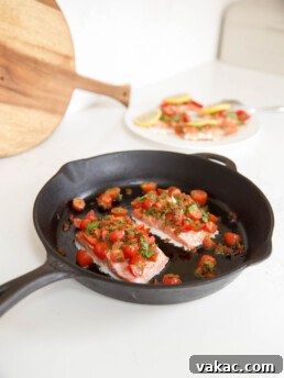 Perfectly baked salmon fillet, glistening and ready to be served, a testament to a quick and easy oven preparation.