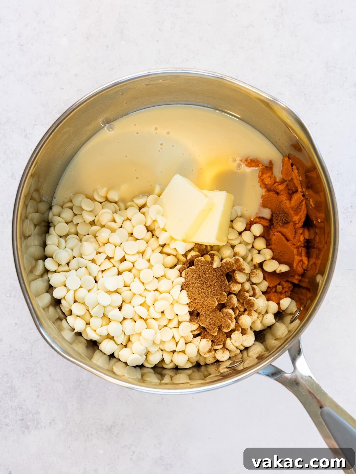 Spiced Pumpkin Fudge 6 An overhead view of pumpkin fudge ingredients in a saucepan.