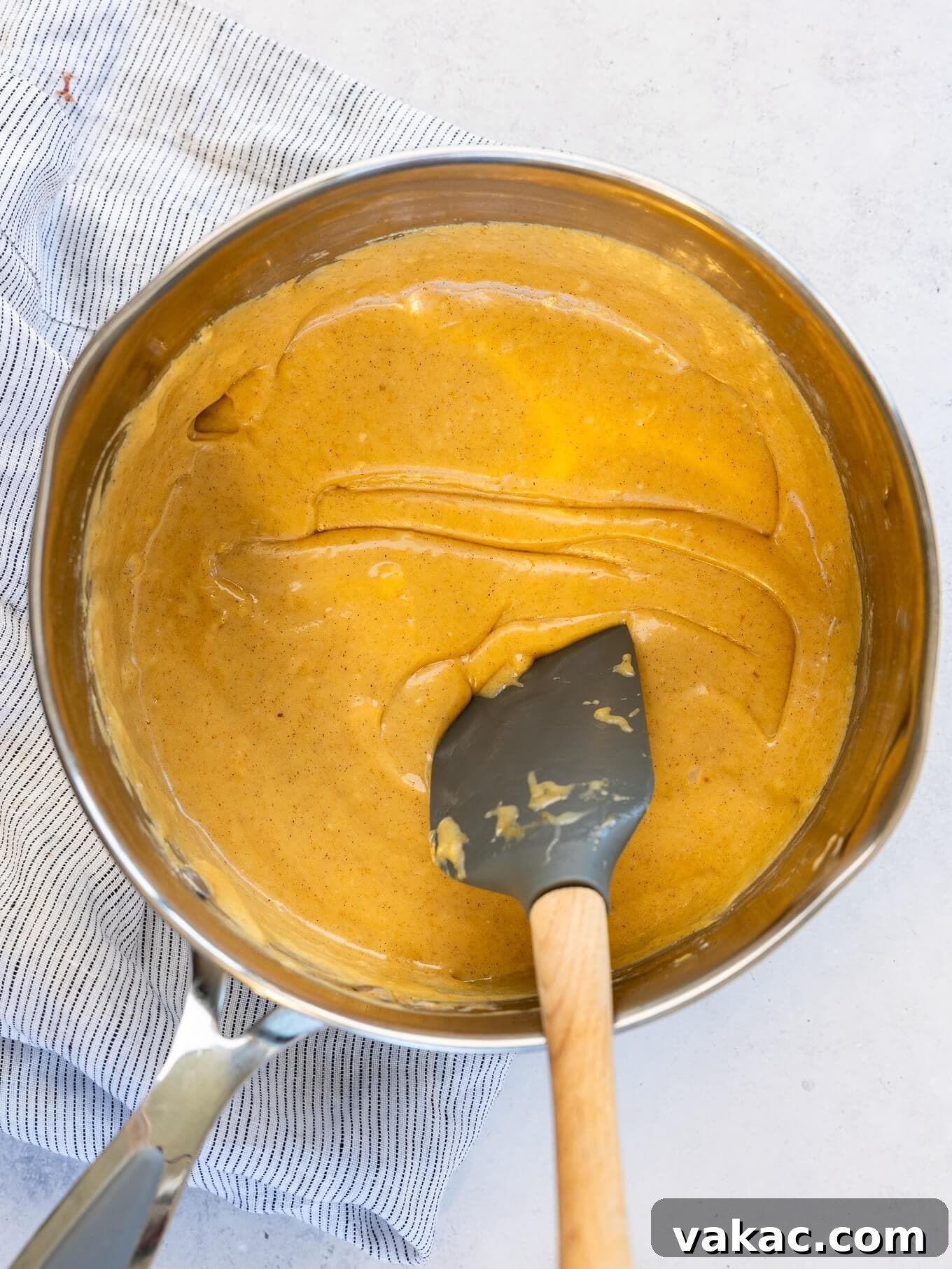 Spiced Pumpkin Fudge 7 An overhead view of melted pumpkin fudge mixture in a saucepan.
