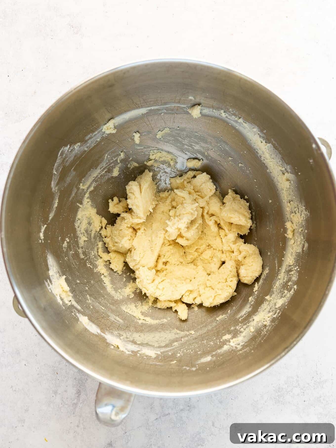 Southern Pecan Treasures 4 An overhead view of the cream cheese crust dough, freshly mixed and sitting in a white mixing bowl, ready for portioning.