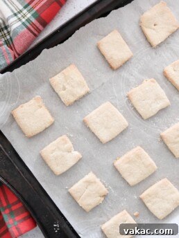 Gluten-free almond flour shortbread cookies, light and crumbly, on a festive red towel.