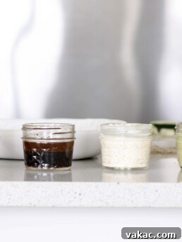 Classic Balsamic Dressing in a clear glass bottle, showcasing its rich, dark color.