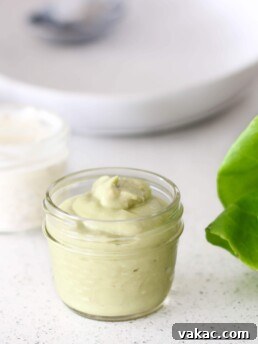 Creamy Garlicky Green Goddess Dressing in a small bowl, ready for dipping or drizzling.