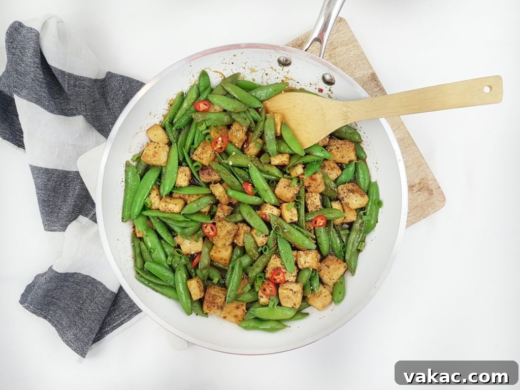 Plant Based Protein Powerhouses for Optimal Health 2 A delicious and healthy plant-based meal featuring tempeh, colorful vegetables, and grains, illustrating its versatility in cooking.