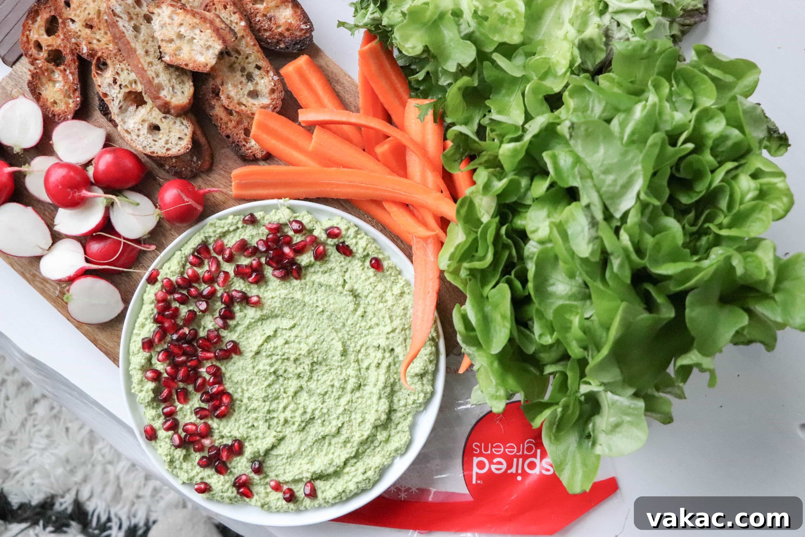 Creamy 5-Ingredient Edamame Dip 2 Bowl of Creamy Edamame Dip with crackers and fresh greens