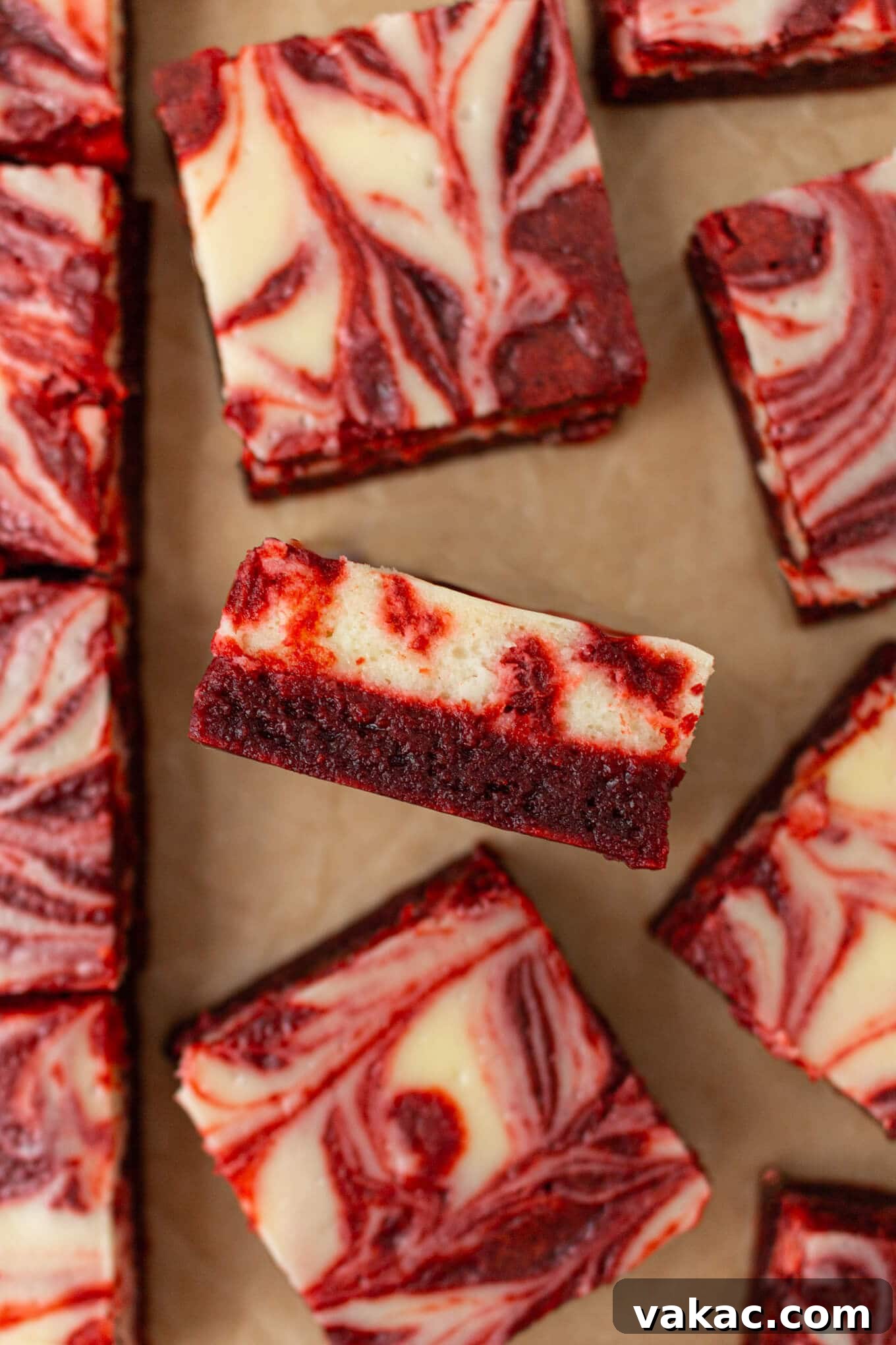 Crimson Cheesecake Brownie Bliss 4 A perfectly sliced Red Velvet Cheesecake Brownie, showcasing the beautiful marbling of red velvet and cheesecake layers.