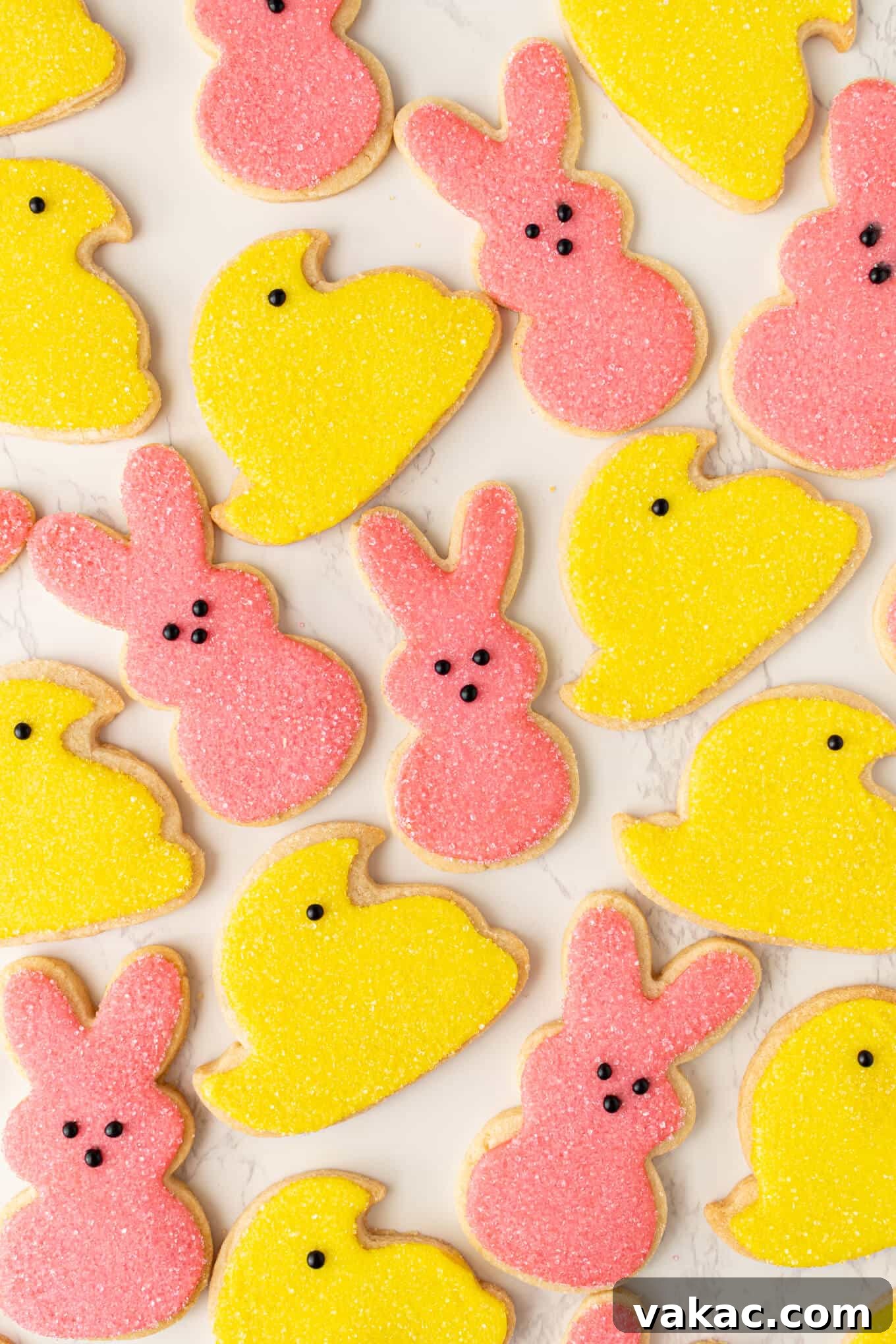 Hoppy Easter Cookies 2 A charming display of intricately iced bunny and chick sugar cookies, adorned with colorful sanding sugar, ready for Easter celebrations.
