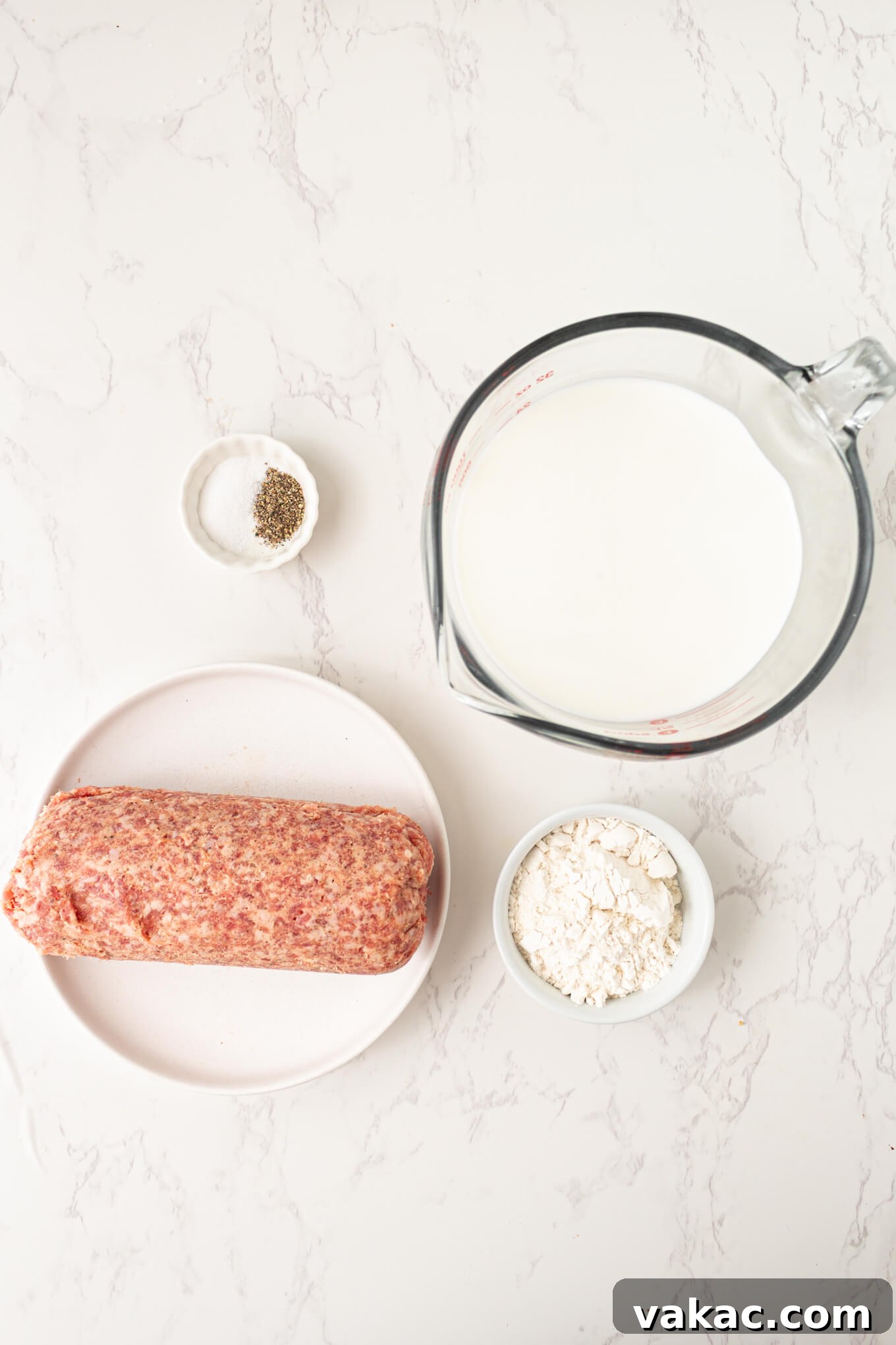 Southern Sausage Gravy Recipe for Biscuits and Breakfast 3 Overhead view of salt and pepper, milk, ground sausage, and flour.