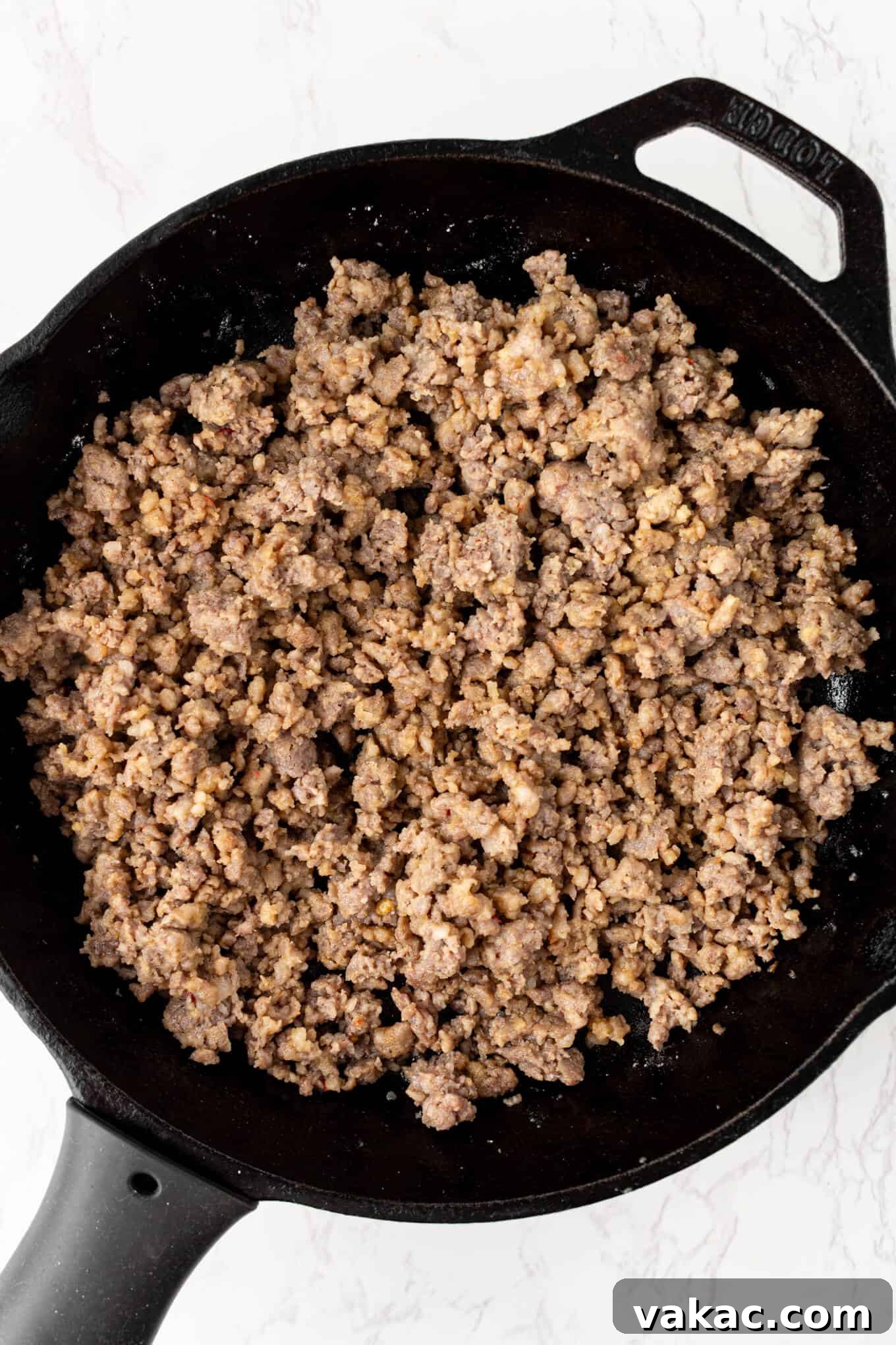 Southern Sausage Gravy Recipe for Biscuits and Breakfast 4 Overhead view of browned sausage in a skillet.