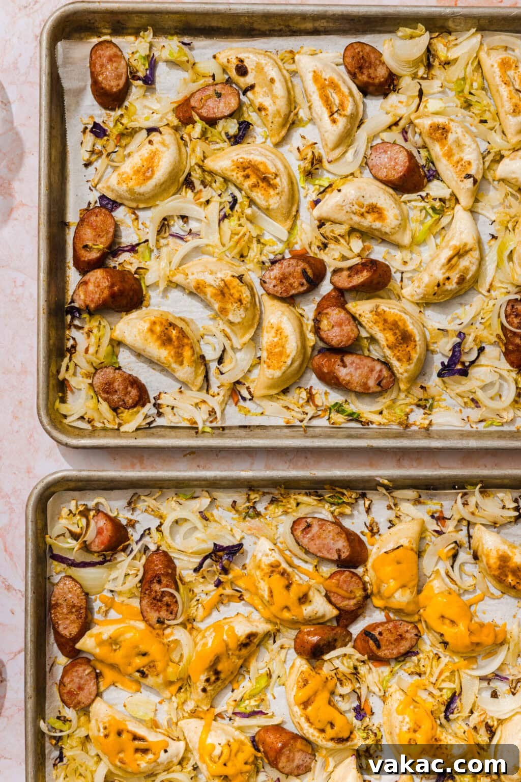 Sheet Pan Kielbasa and Pierogies from Frozen to Crispy 6 Two sheet pans with roasted pierogies, sliced sausage, onions, and cabbage; one pan has melted cheddar cheese on top. All ingredients are evenly spread on parchment-lined trays.